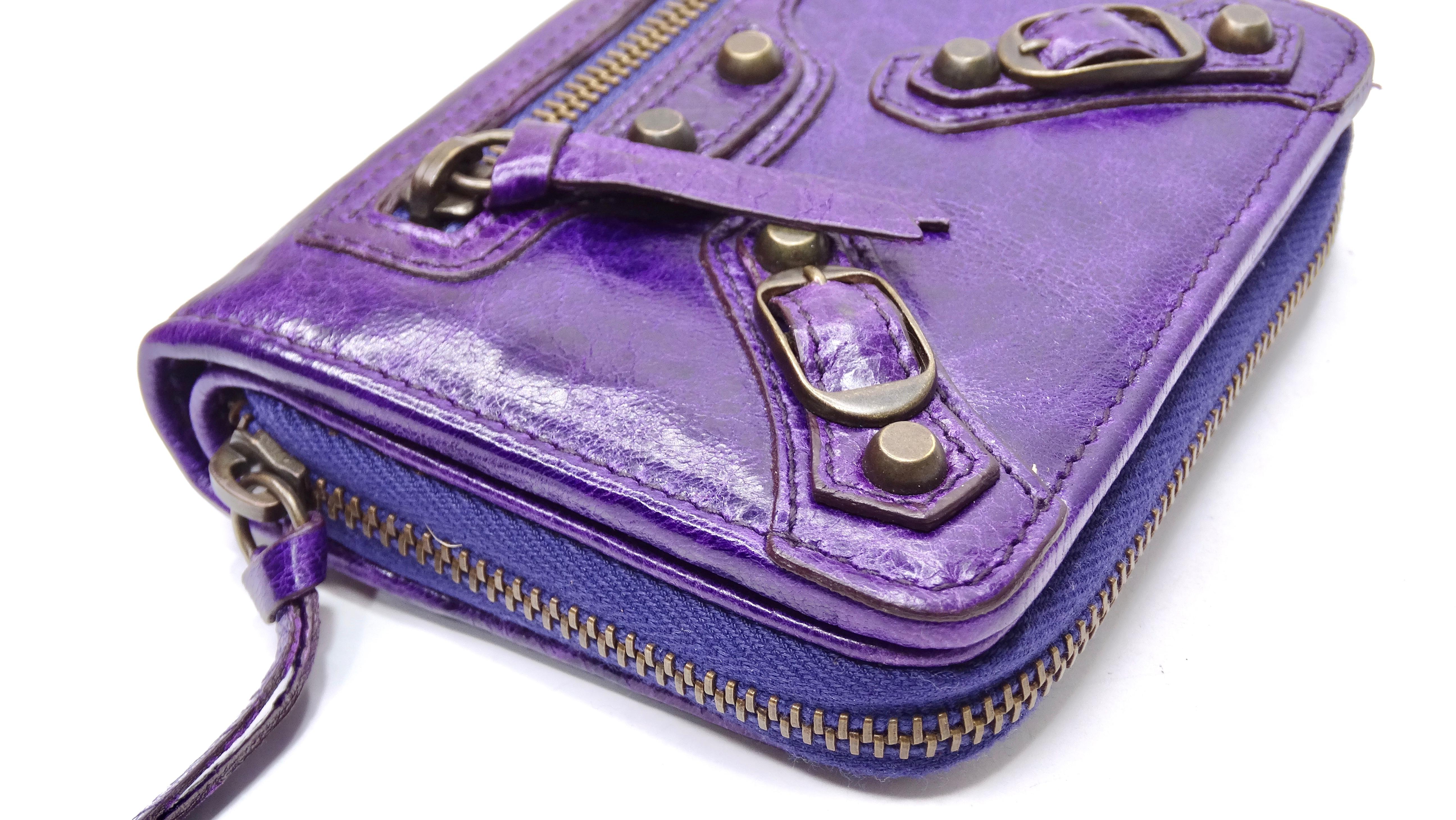 Snag the coolest vintage gem today! This wallet it an authentic and original city-style that was bought from Barneys New York in the early 2000's. This wallet is made of a beautiful and soft vibrant purple leather with cool an aged bronzed hardware