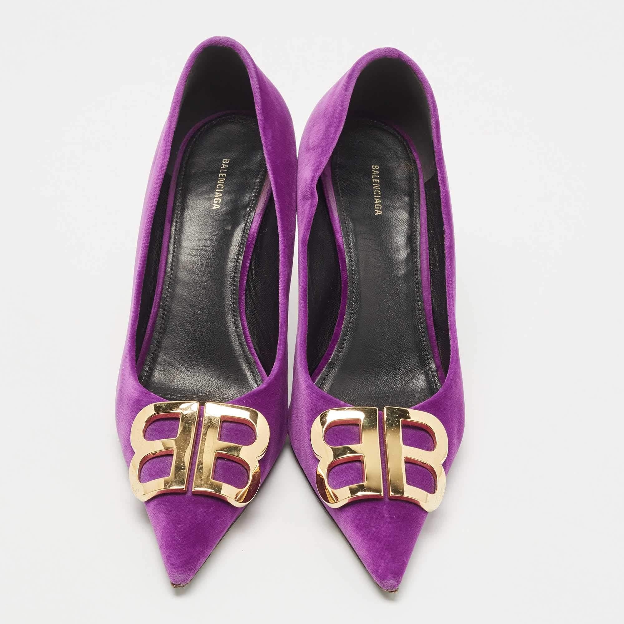 Sleek and sharp, this pair of Balenciaga pumps will complement a variety of outfits in your wardrobe. The velvet creation features a purple hue and logo motif on the upper Elevated on 9cm heels, it will take your fashion statement a notch higher.

