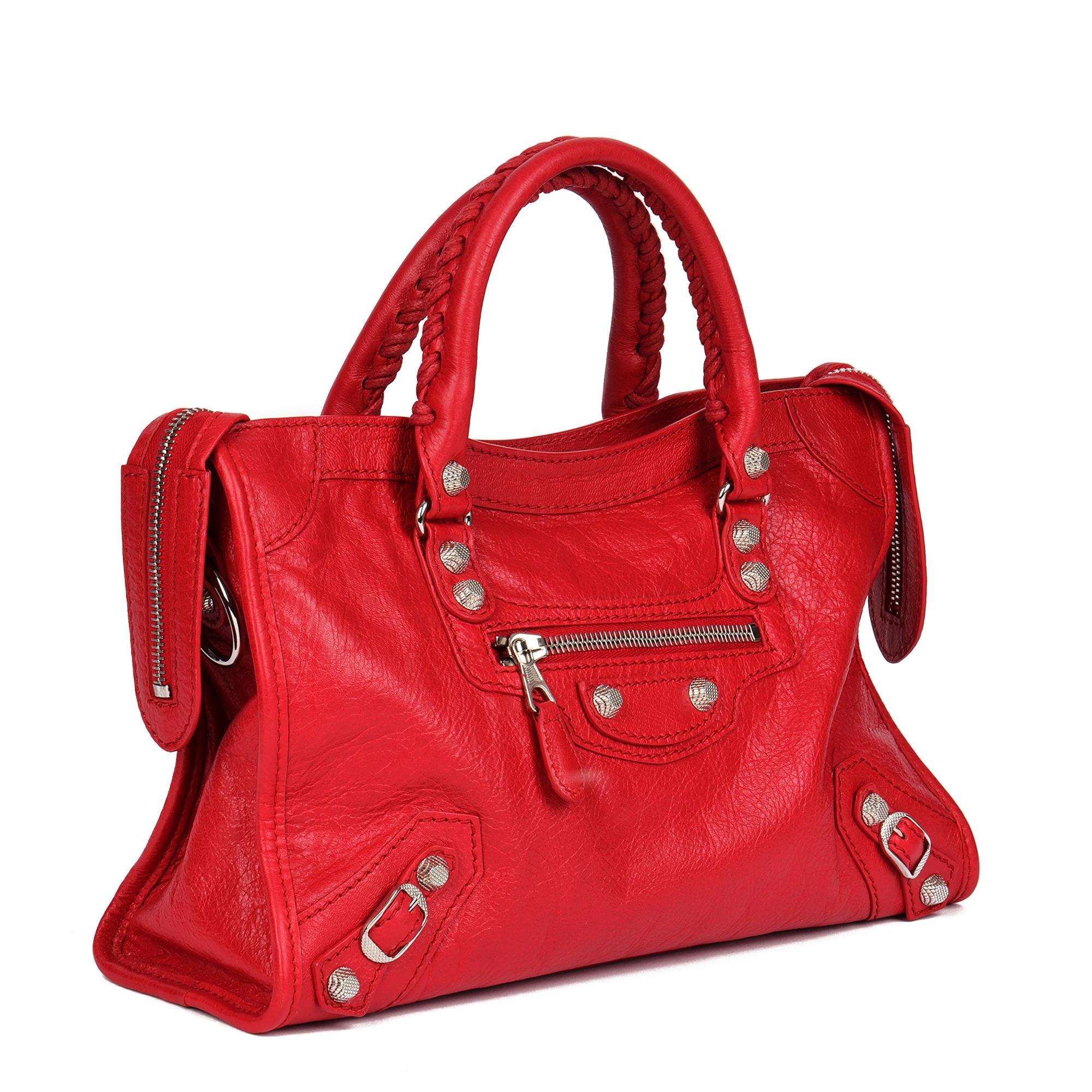 BALENCIAGA
Red Aged Lambskin Small City Bag

Serial Number: 542022.6420.Z.528147.O
Age (Circa): 2005
Accompanied By: Balenciaga Dust Bag, Care Booklet, Shoulder Strap 
Authenticity Details: Date Stamp (Made in Italy)
Gender: Ladies
Type: Tote,