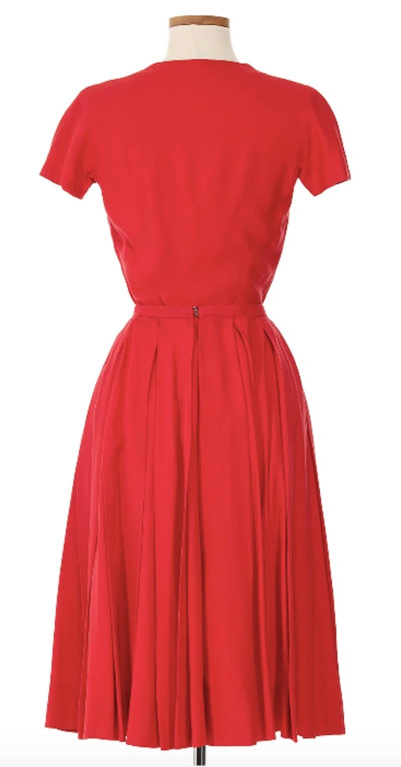 Balenciaga Red Skirt Suit circa 1960s. From the golden age of Cristóbal Balenciaga, this vibrant red skirt suit exudes the femininity and elegance of 60s fashion. Perfectly tailored to the waist with intricate pleating along the skirt. This ensemble