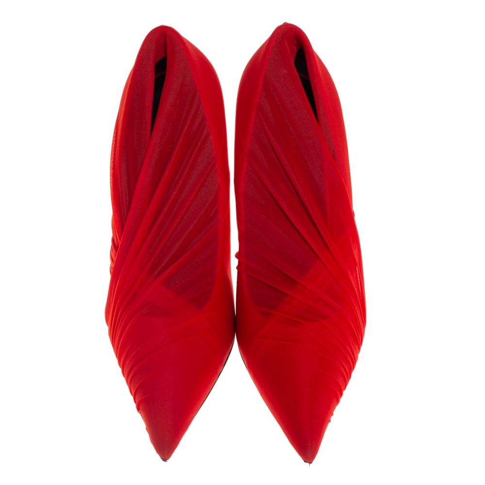Creations from Balenciaga are effortlessly stylish just like these pumps. They have been designed in a pointed-toe silhouette from red stretch fabric and styled with ruched detailing that looks quite eye-catching. They are complete with comfortable