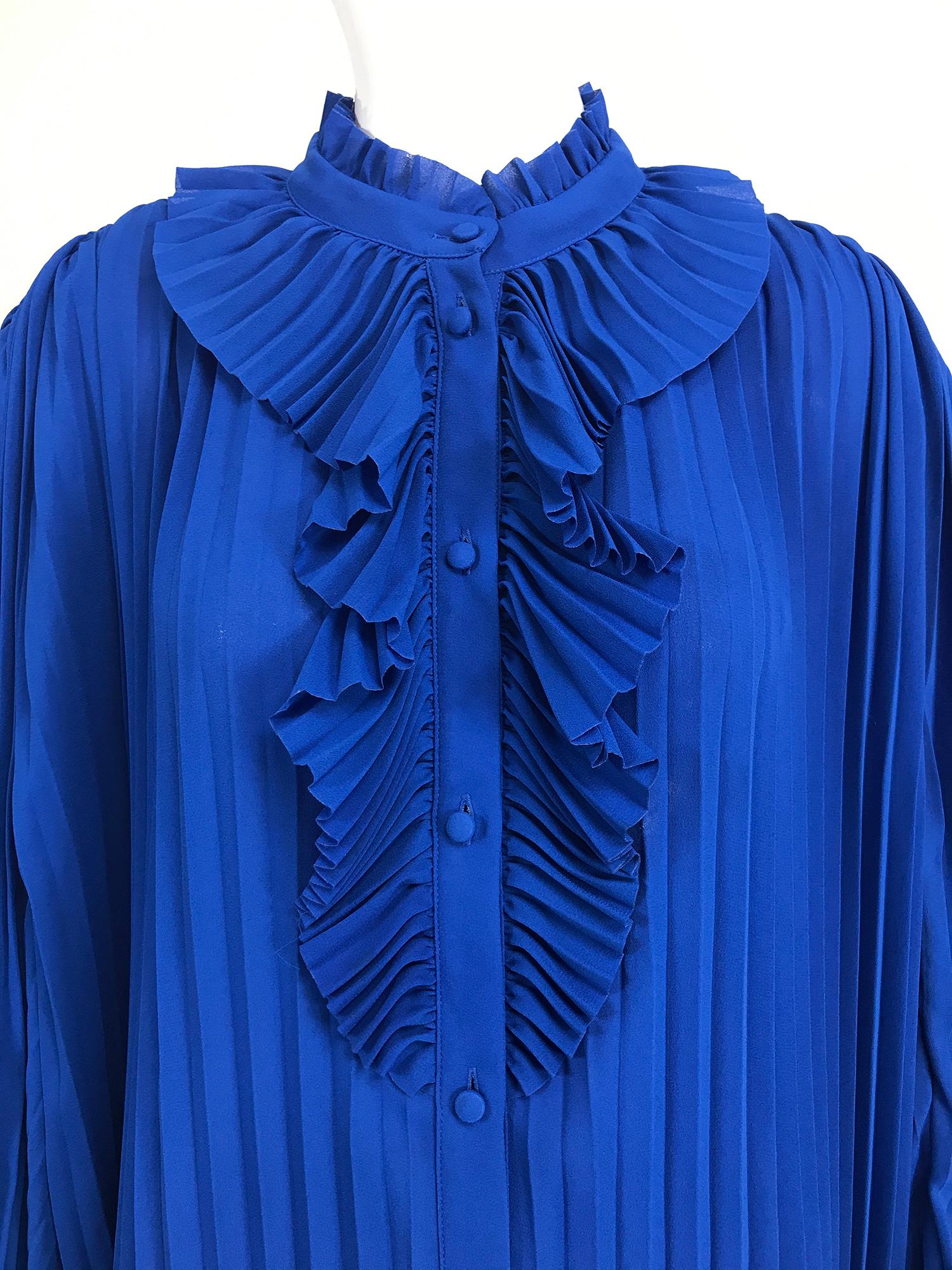 Balenciaga Resort 2017 multi style, royal blue accordion pleated tunic, blouse. This tunic is cut full and loose with long full sleeves pleated for fluidity, it is finished with slit sleeves and a ruffled front placket. It can be styled in multiple