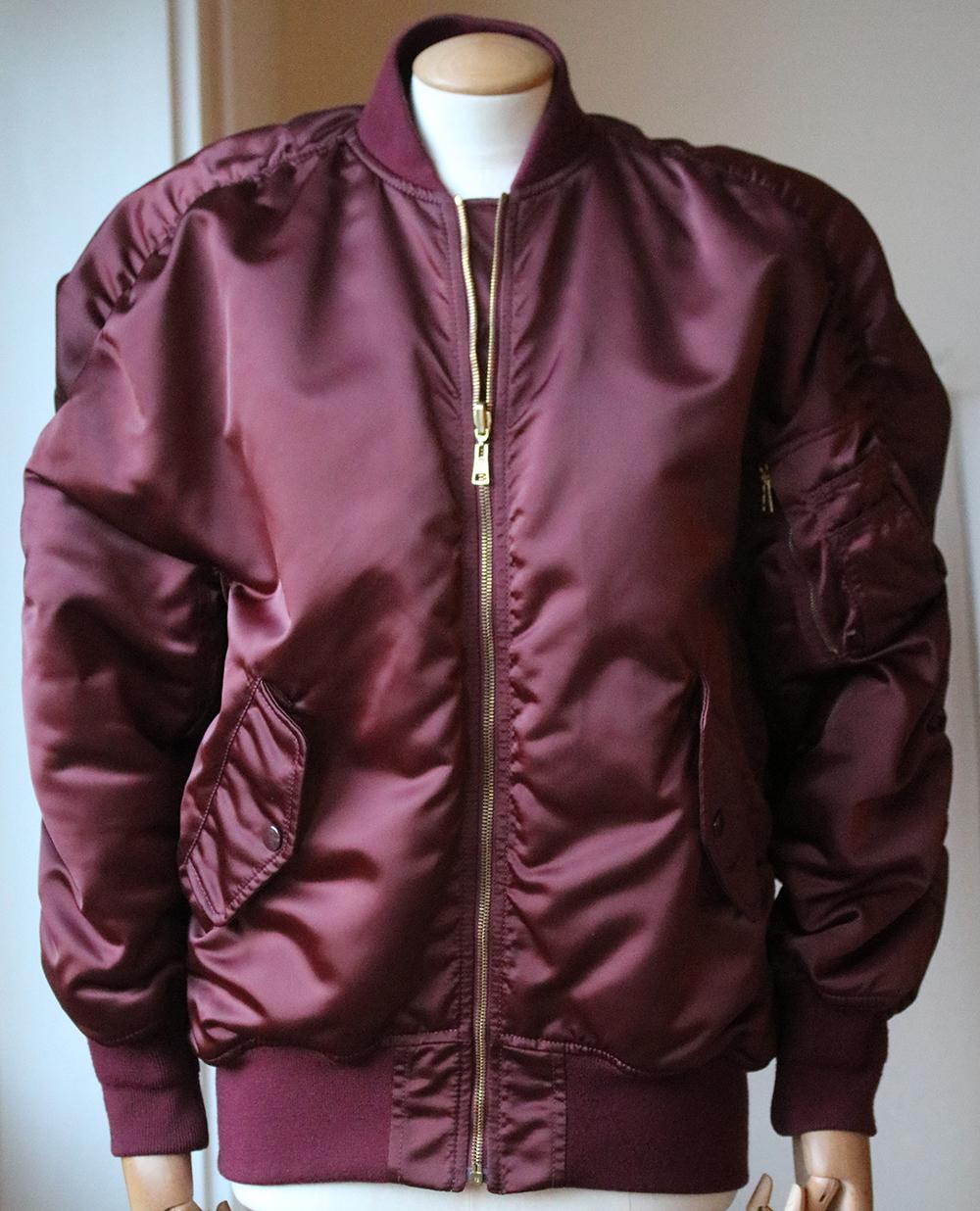 Balenciaga's reversible bomber jacket comes with two personalities: one side is chic and classic in burgundy, while the other packs statement punch with its bright orange hue. 100% polyamide. Filling: 95% polyester, 5% polyamide. Lining: 100% cupro.