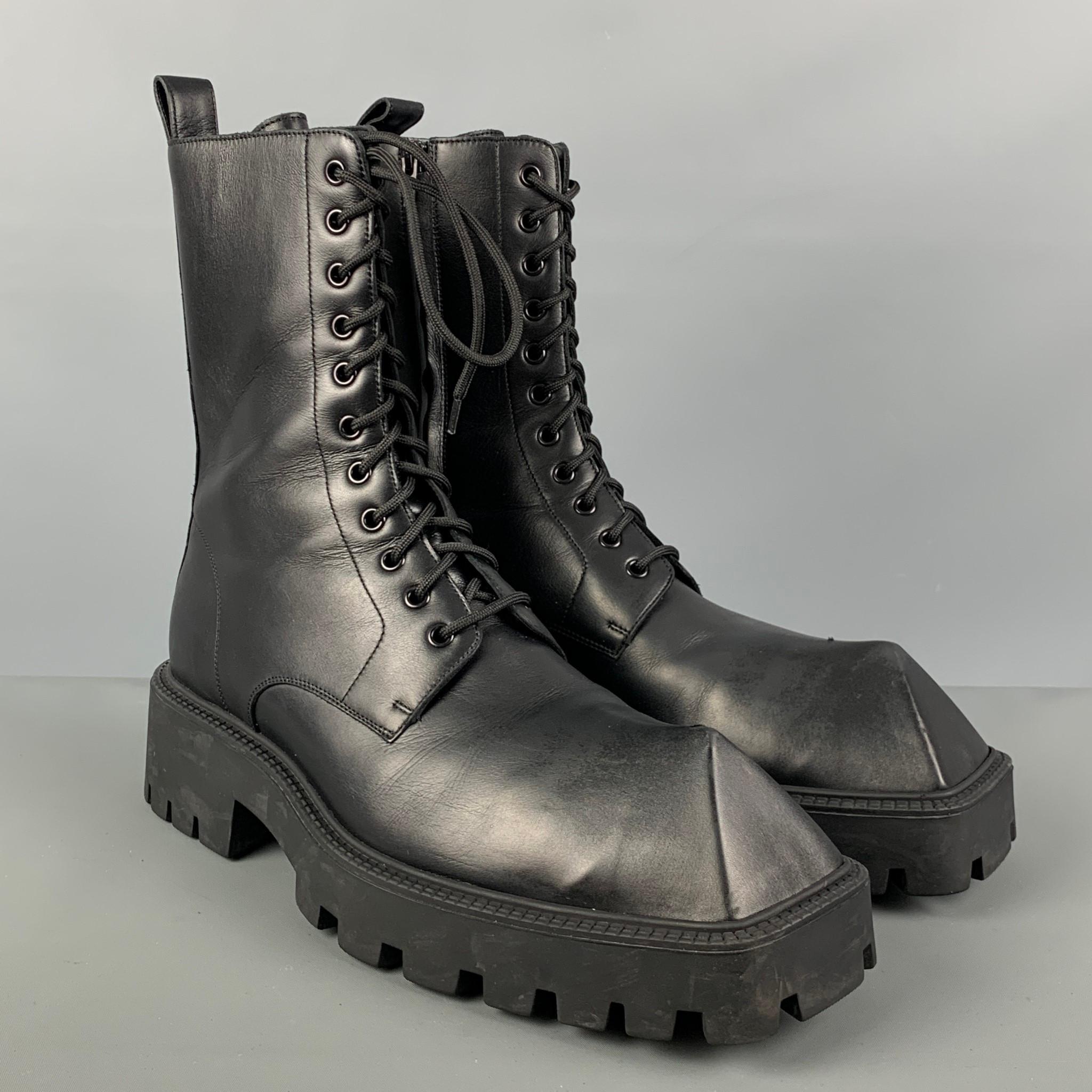 BALENCIAGA 'RHINO' boots comes in a black calf skin leather featuring a chunky design, pyramid toe shape, tick toothed out rubber sole, and a lace up closure. Made in Italy.

Very Good Pre-Owned Condition. Minor mark on top of left boot.
Marked: