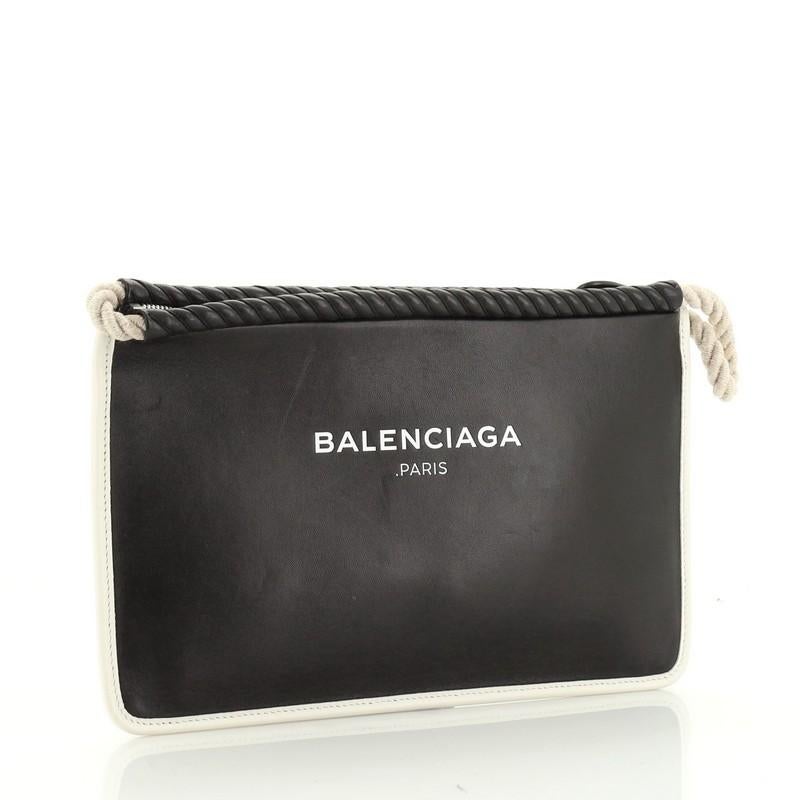 This Balenciaga Rope Logo Pouch Leather Small, crafted from black leather, features logo lettering, rope detailing and silver-tone hardware. Its zip closure opens to a neutral canvas interior. 

Estimated Retail Price: $850
Condition: Very good.