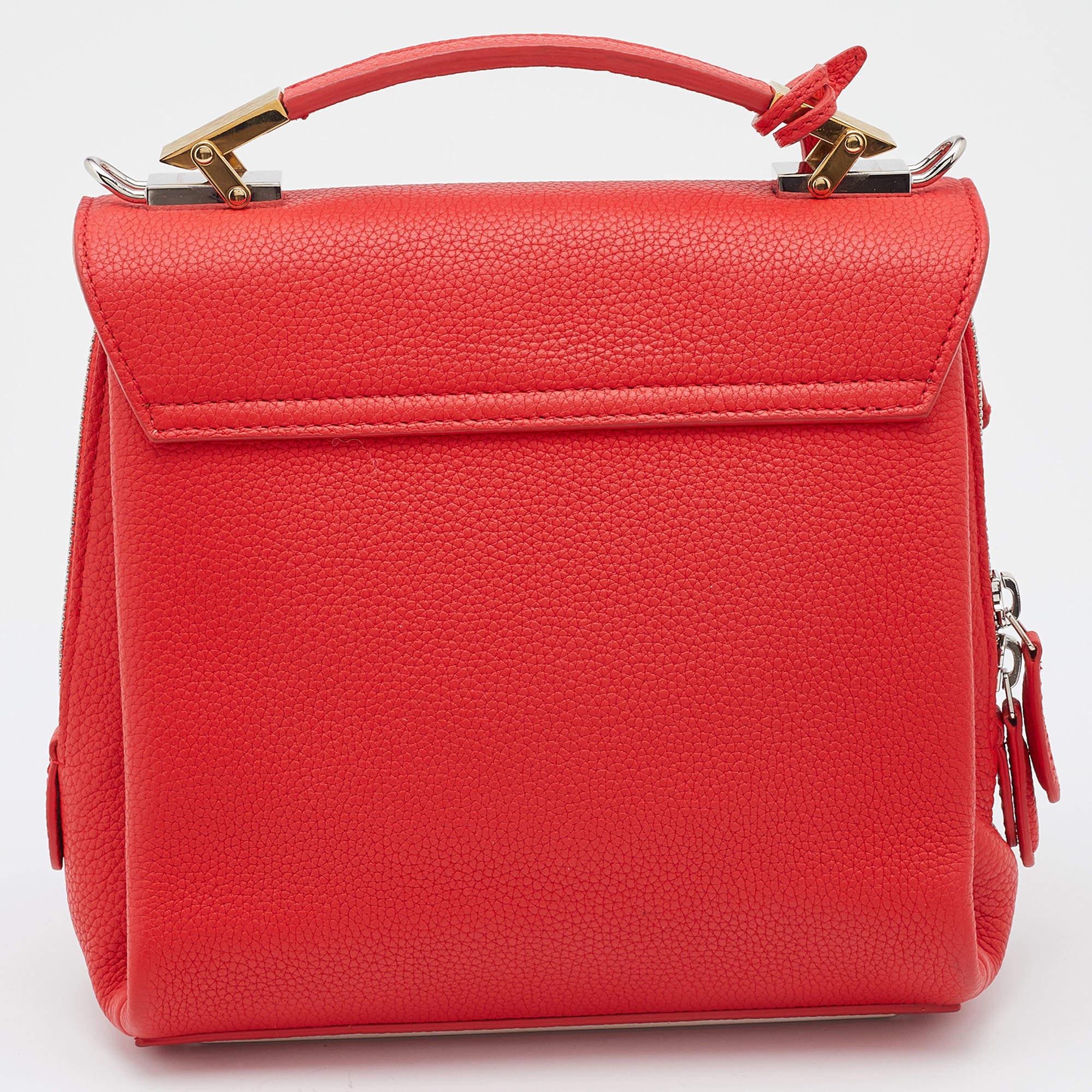 This Balenciaga design exudes luxury and beauty! It comes crafted from leather and added with a front flap, and a top handle. The rose hue gives the exterior a fresh look, and the long strap allows shoulder as well as crossbody wear.

Includes: Info