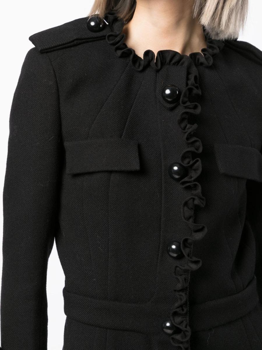 Trimmed with ruffled detailing, this vintage pre-owned Balenciaga jacket from 2006/2007 has been crafted in italy from wool. Designed in a fitted silhouette, it's punctuated with black buttons and a smooth silk lining making it the perfect layering