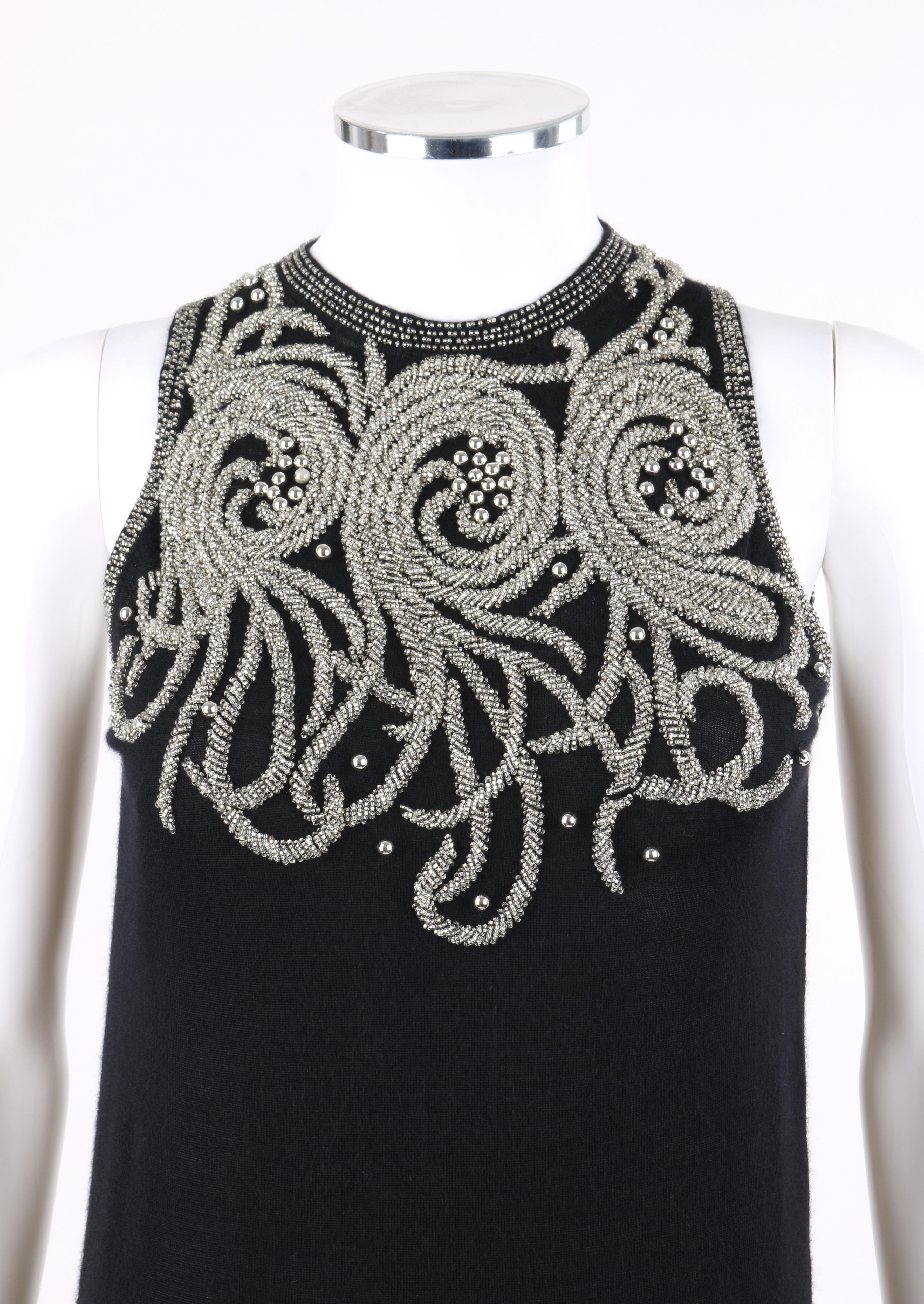 BALENCIAGA S/S 2006 Black Silver Embellished Cashmere Sleeveless Sweater Top 

Brand / Manufacturer: Balenciaga
Collection: S/S 2006
Designer: Nicolas Ghesquiere
Style: Sleeveless sweater top
Color(s): Shades of black and silver
Lined: No
Marked