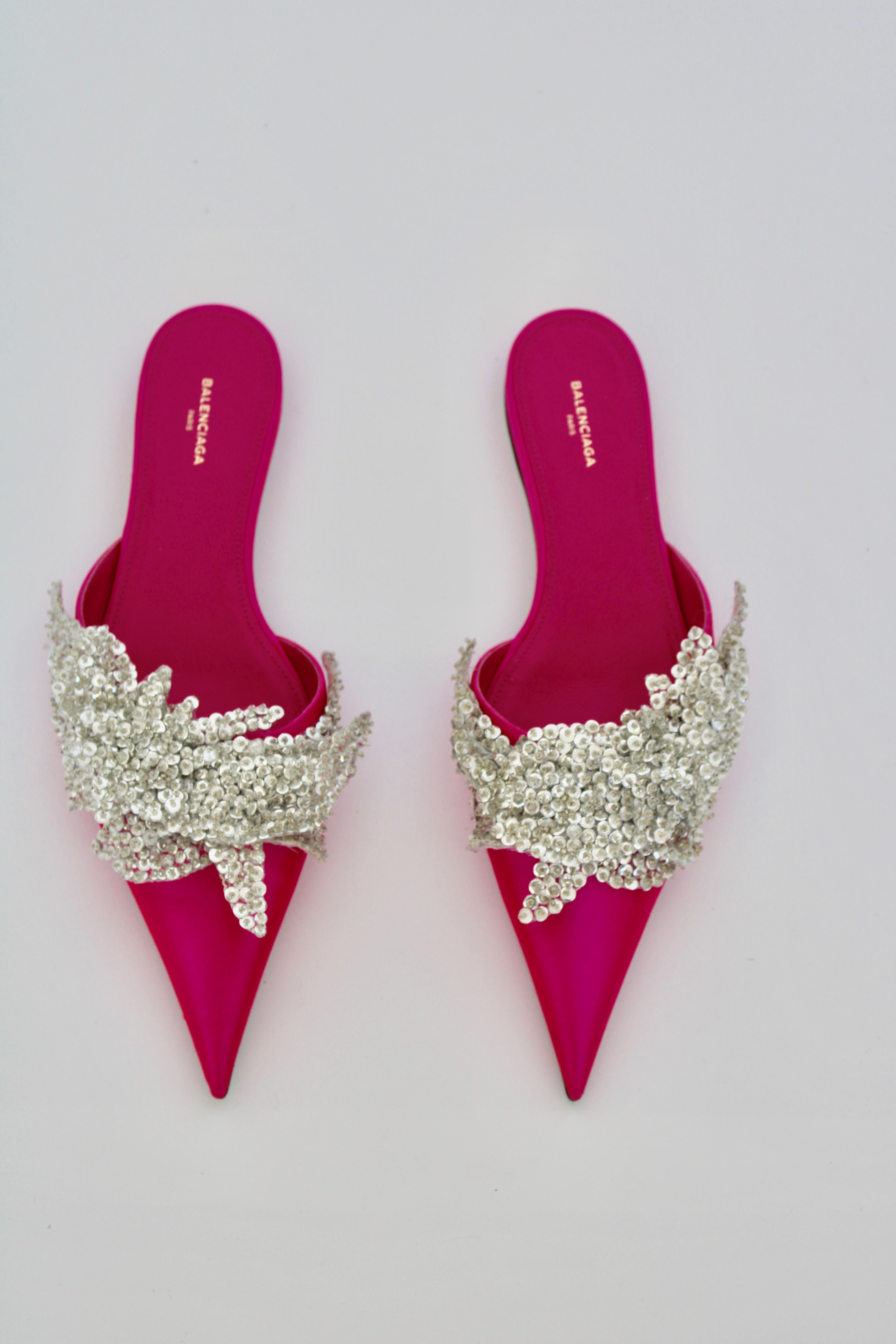 Pointed toe mule flat w/ crystal embellishment across the vamp. 