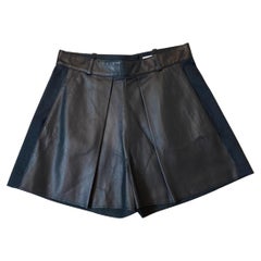 Balenciaga shorts in black leather and cotton.