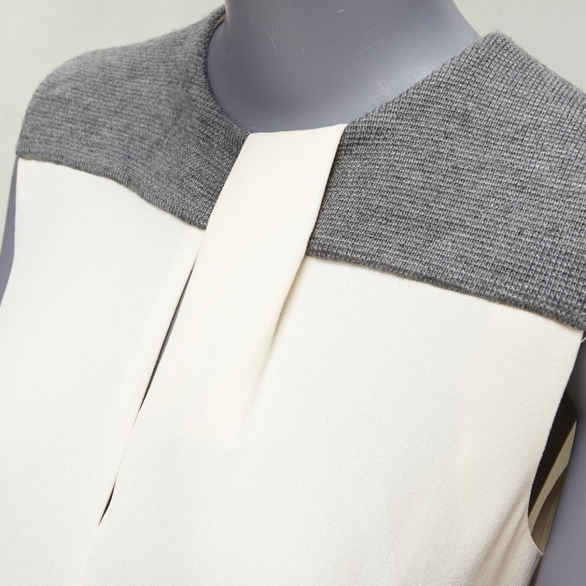 BALENCIAGA Silk 2014 cream silk crepe grey knitted yoke cut out blouse FR38 M
Reference: YIKK/A00057
Brand: Balenciaga
Designer: Nicolas Ghesquiere
Collection: 2014 Silk
Material: Silk, Acrylic, Blend
Color: Cream, Grey
Pattern: Solid
Closure: