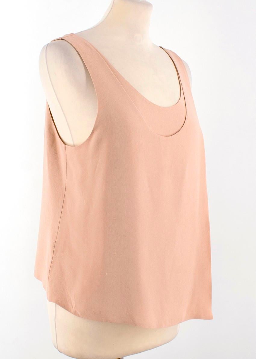 Balenciaga Silk Nude Sleeveless Asymmetric Top

- Sleeveless
- Scoop neckline
- Nude pure silk 
- Double layer at the front with an asymmetric hem

Please note, these items are pre-owned and may show some signs of storage, even when unworn and