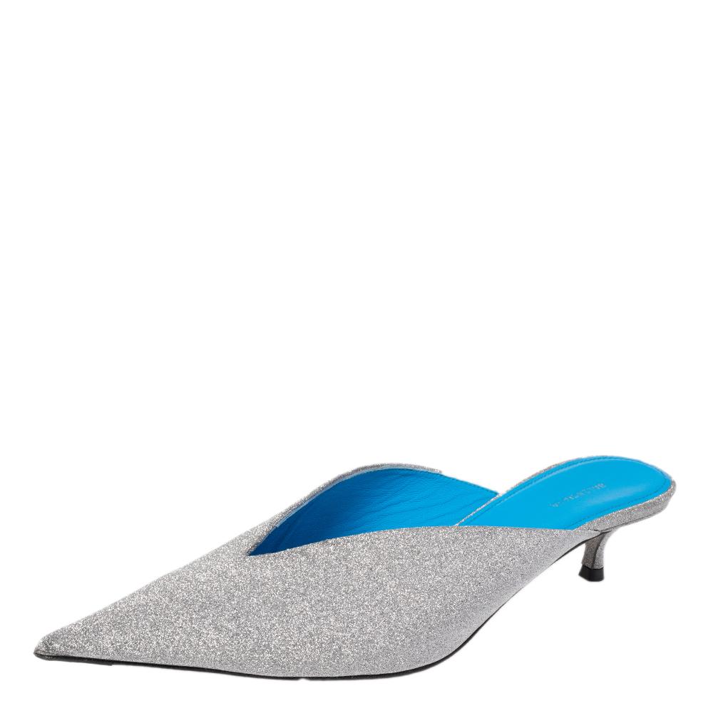 If you are an admirer of the latest fashion trends, this pair of Balenciaga Knife mules will add just the right vibe to your closet. The pointed-toe sandals are made from leather and covered in silver glitter and detailed with sleek lines and low