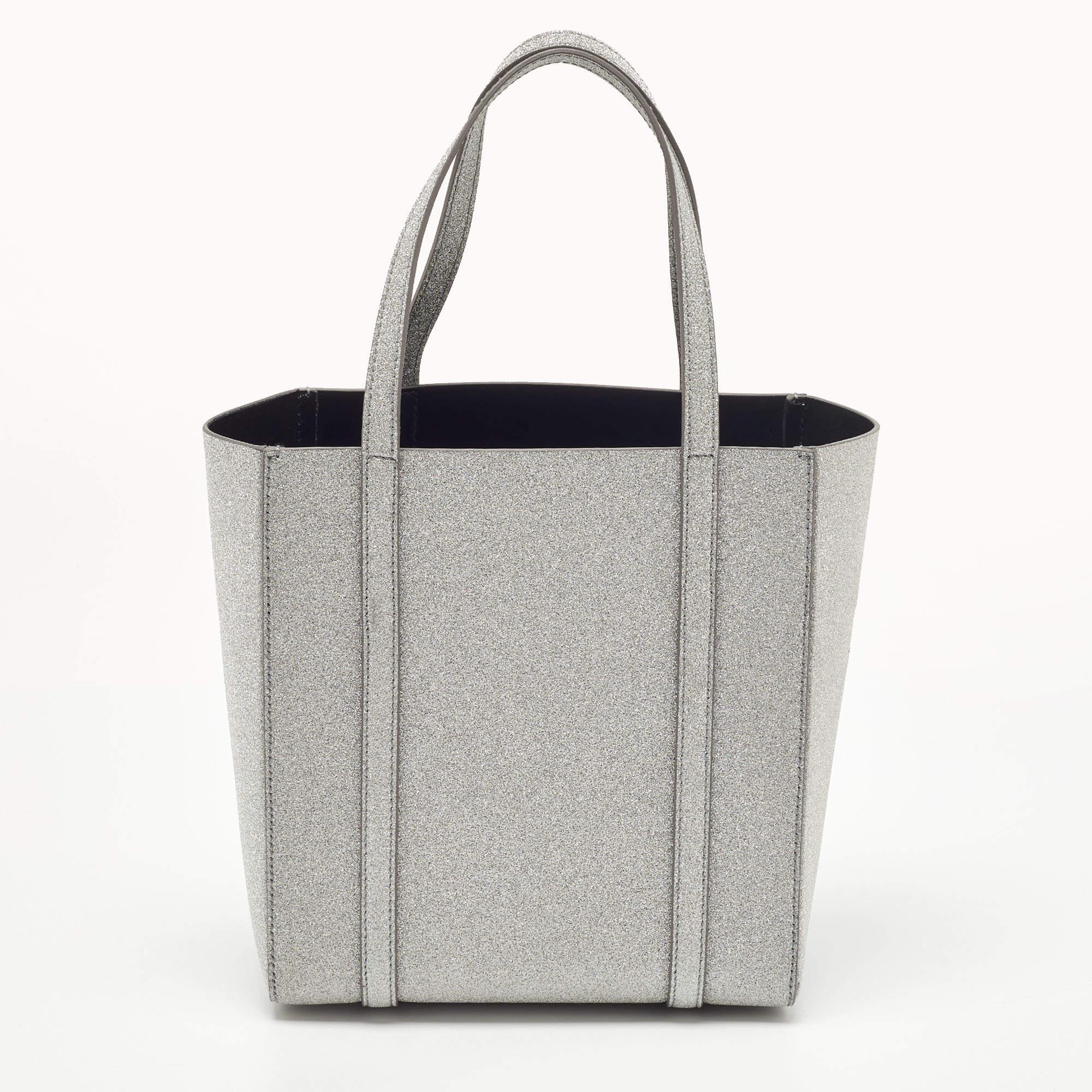 Be it your daily commute to work, shopping sprees, and vacations, a tote bag will never fail you. This designer creation is made to last and assist you in your fashion-filled days.

Includes: Info Booklet, Detachable Strap

