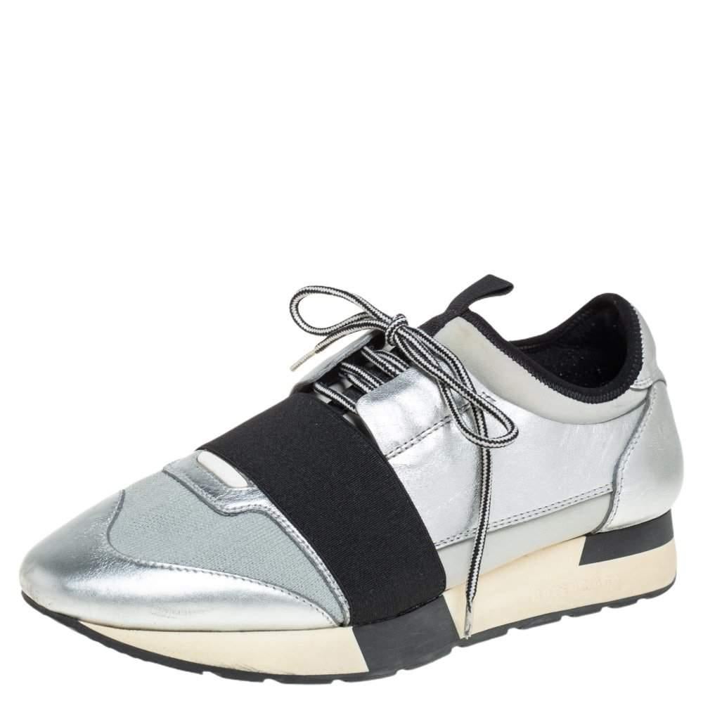 Let your latest sneaker addition be this pair of low-top Race Runners from Balenciaga. These silver sneakers have been crafted from Neoprene, leather, and knit fabric. They feature a chic silhouette, covered toes, strap detailing on the vamps, and