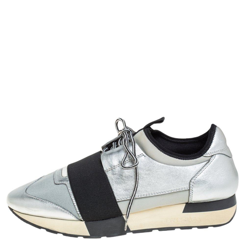 Let your latest sneaker addition be this pair of low-top Race Runners from Balenciaga. These silver sneakers have been crafted from Neoprene, leather, and knit fabric. They feature a chic silhouette, covered toes, strap detailing on the vamps, and