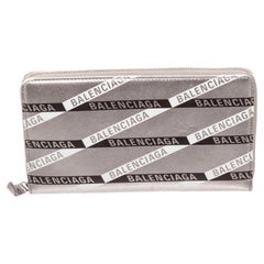Balenciaga Silver Leather Zippy Wallet with silver-tone hardware, grey Arena
