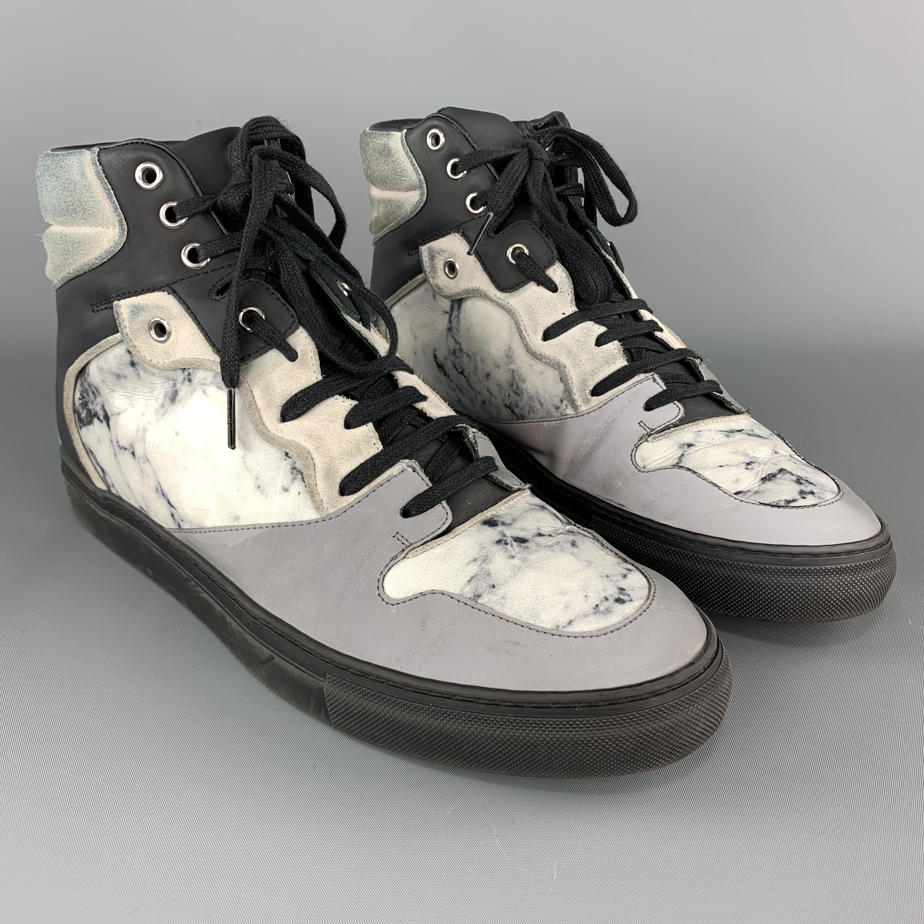 BALENCIAGA high top sneakers come in white marble print leather with cream suede panels, black rubber panels, and reflective front. Wear and discolorations throughout. As-is. Made in Italy.

Fair Pre-Owned Condition.
Marked: IT 43

Outsole: 12 x 4