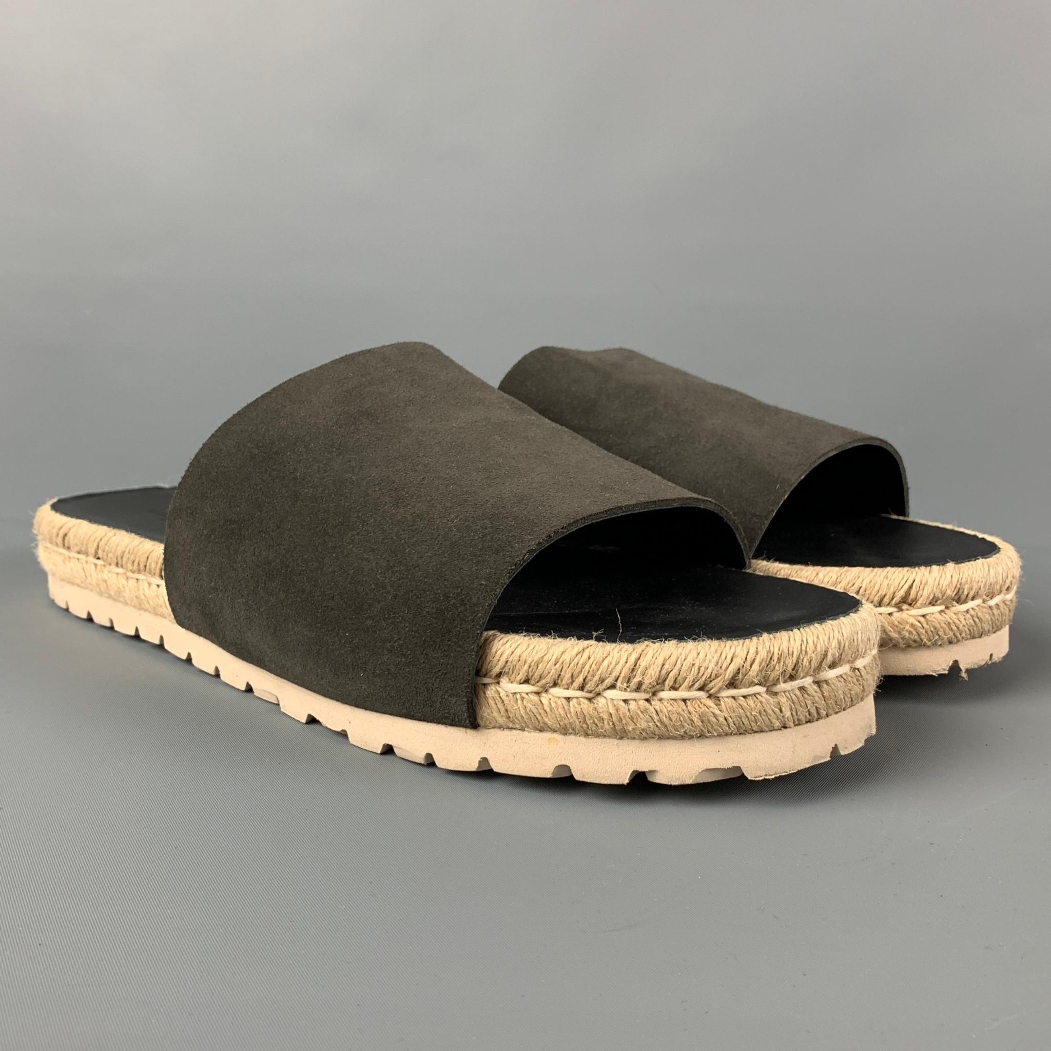BALENCIAGA sandals comes in a grey & black leather featuring a natural rope espadrille trim and a slip on style. Made in Spain. 

New With Box. 
Marked: 45
Original Retail Price: $430.00

Outsole: 12 in. x 4 in. 