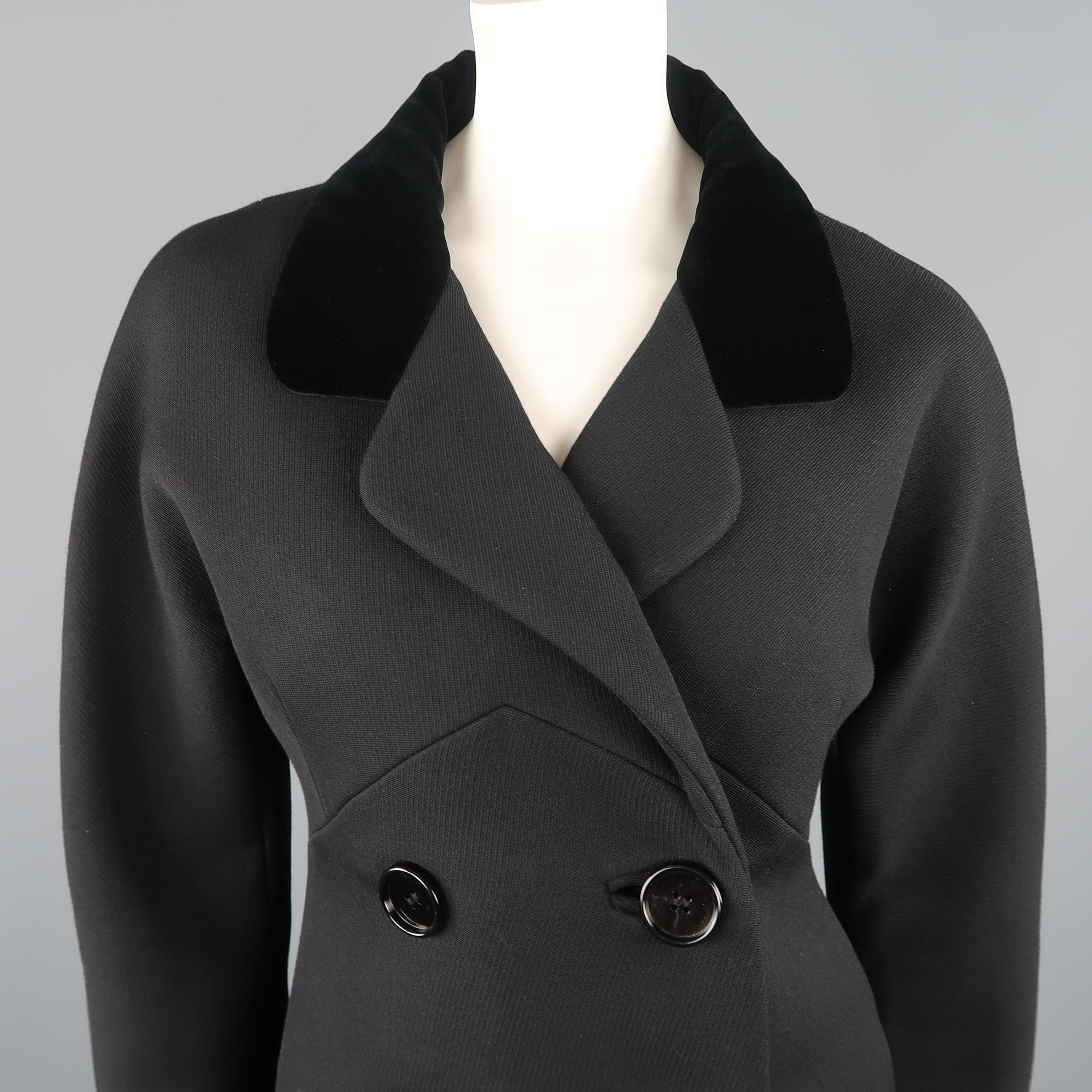 BALENCIAGA coat comes in a structured wool twill with a double breasted four button front, underbust seam detail, round shoulder, slit pockets, and velvet collared lapel. Made in France.
 
Excellent Pre-Owned Condition.
Marked: FR 38
