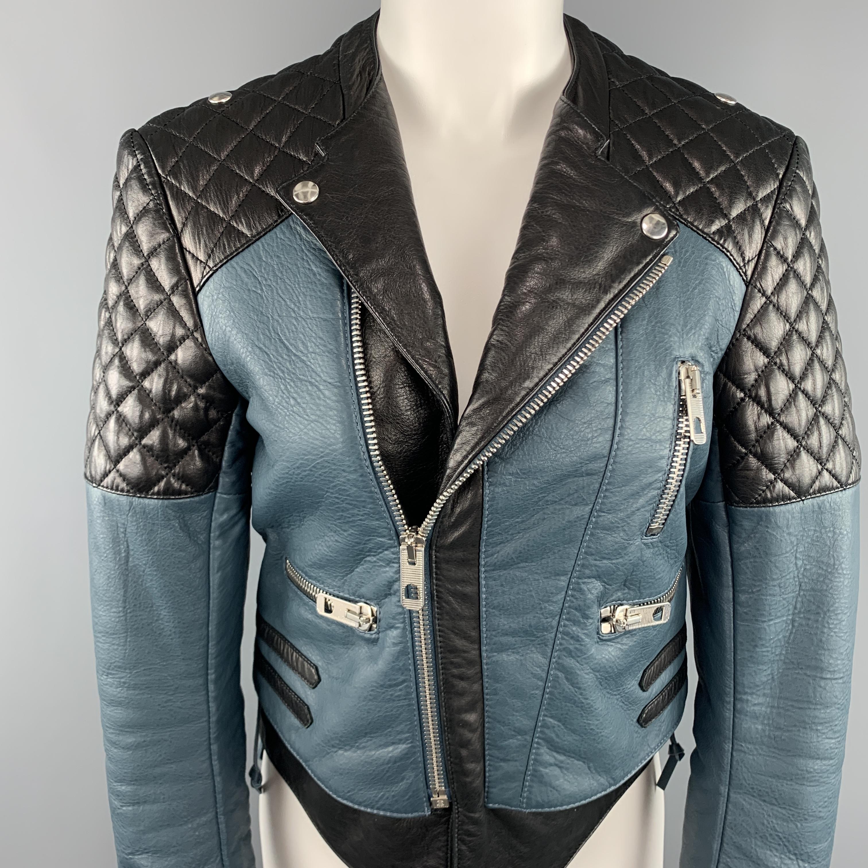 BALENCIAGA.LEATHER biker style moto jacket by NICOLAS GHESQUIERE comes in teal blue and black color block panel leather with a round neckline, pointed lapel, asymmetrical zip closure, silver tone slanted zip pockets, zip cuffs, quilted shoulders,