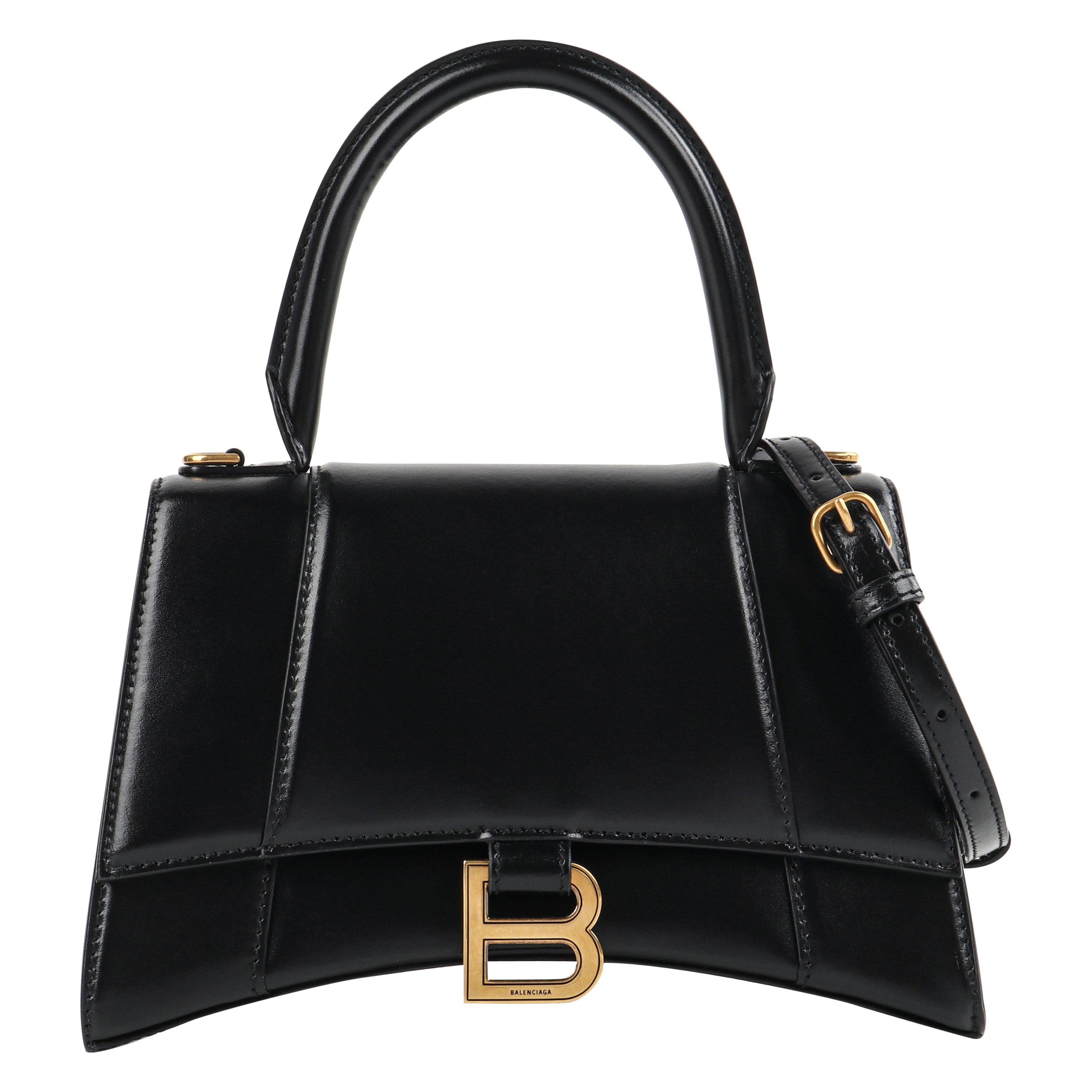 BALENCIAGA Kleine Tasche mit "Sanduhr"-Griff aus schwarzem:: glänzendem Kalbsleder und goldenen Messingbeschlägen
