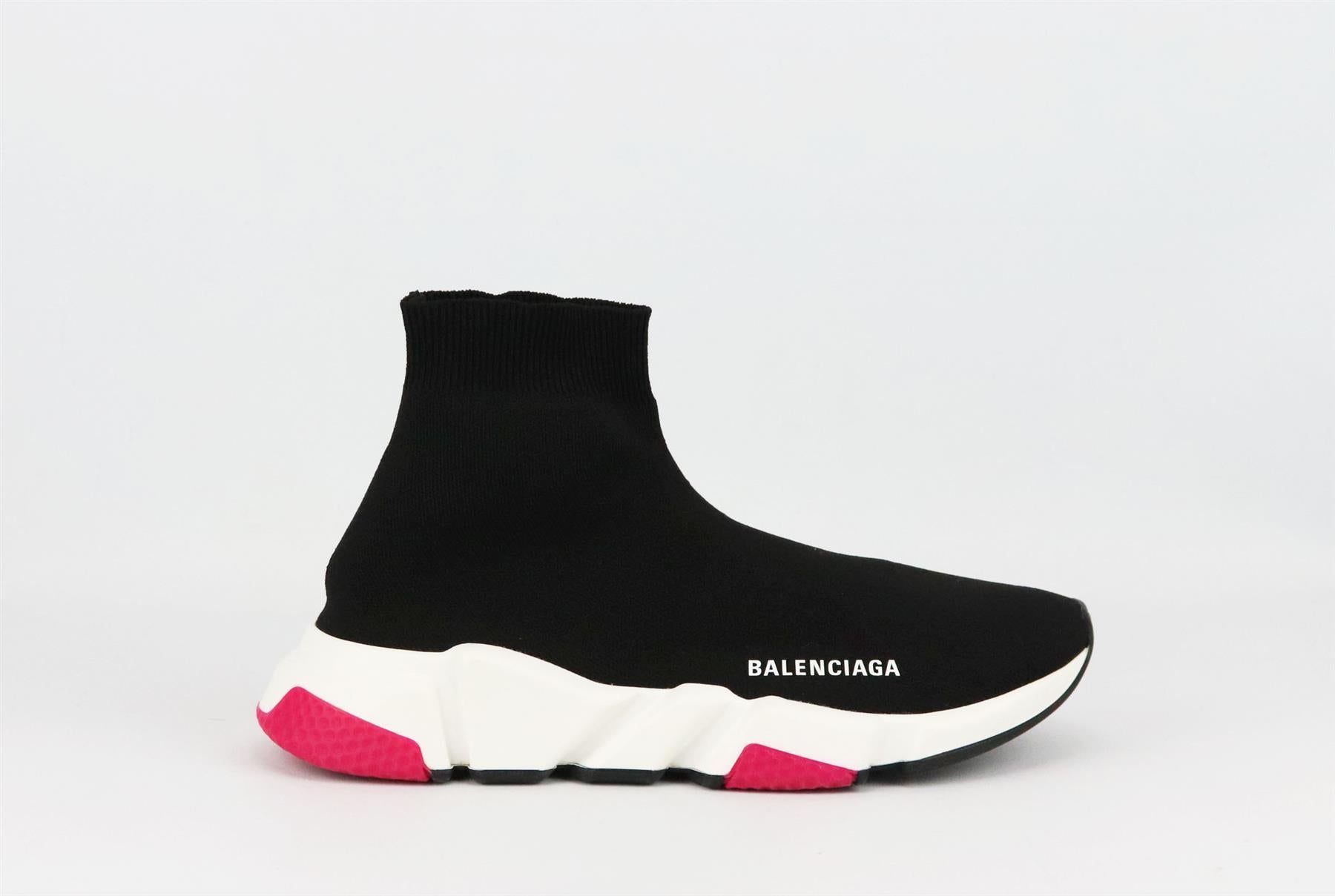 Balenciaga's 'Speed Runner' sneakers are designed for a cool sock-like fit – this season's must-have silhouette, made from black stretch-knit, this high-top style is set on a white gripped sole and subtly detailed with the brand’s emblem. 
Rubber