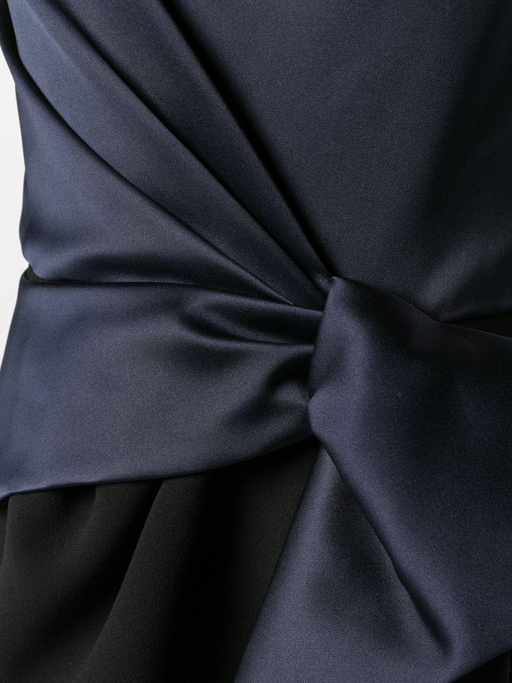 Crafted in France from an intricate blend of cotton and polyester, this pre-owned, couture gown from Balenciaga is expertly cut on the bias to reveal a fluid yet fitted silhouette and distinctive wrap style front. Showcasing a strapless navy bodice,