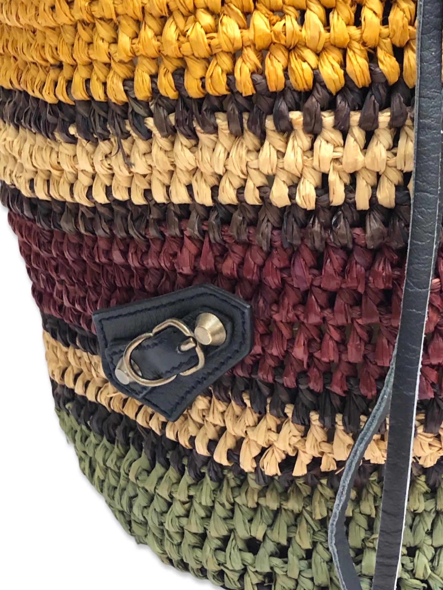 - Balenciaga stripe multi colours bamboo straw bucket bag in their signature motorcycle style bucket bag. It is great to carry around to any summer holiday destinations. 

- Featuring a leather pouch with mirror. Front zipper with a leather strap