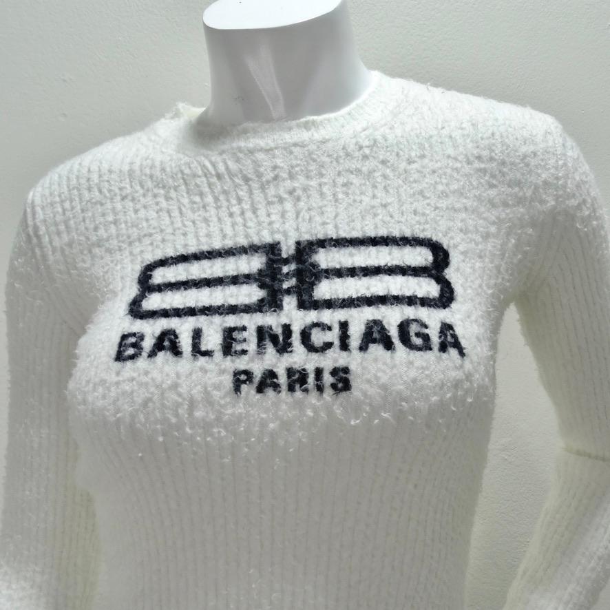 Fuzzy and luxurious brand new Balenciaga crewneck sweater with tags! The softest thick white ribbed knit is contrasted by a signature black Balenciaga logo printed across the center of the front. This is such a versatile and staple piece that will