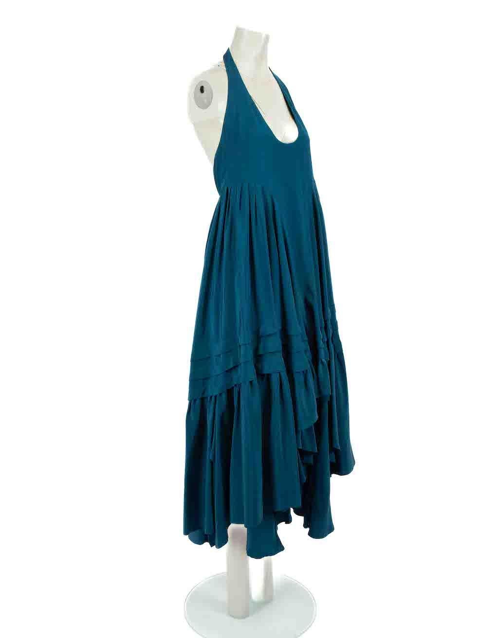 CONDITION is Very good. Minimal wear to dress is evident. Minimal loose threads to seam of ruffles on this used Balenciaga designer resale item.
 
Details
Teal
Silk
Gown
Open back
Halterneck
Maxi
Pleated
Tiered skirt
Side zip and hook