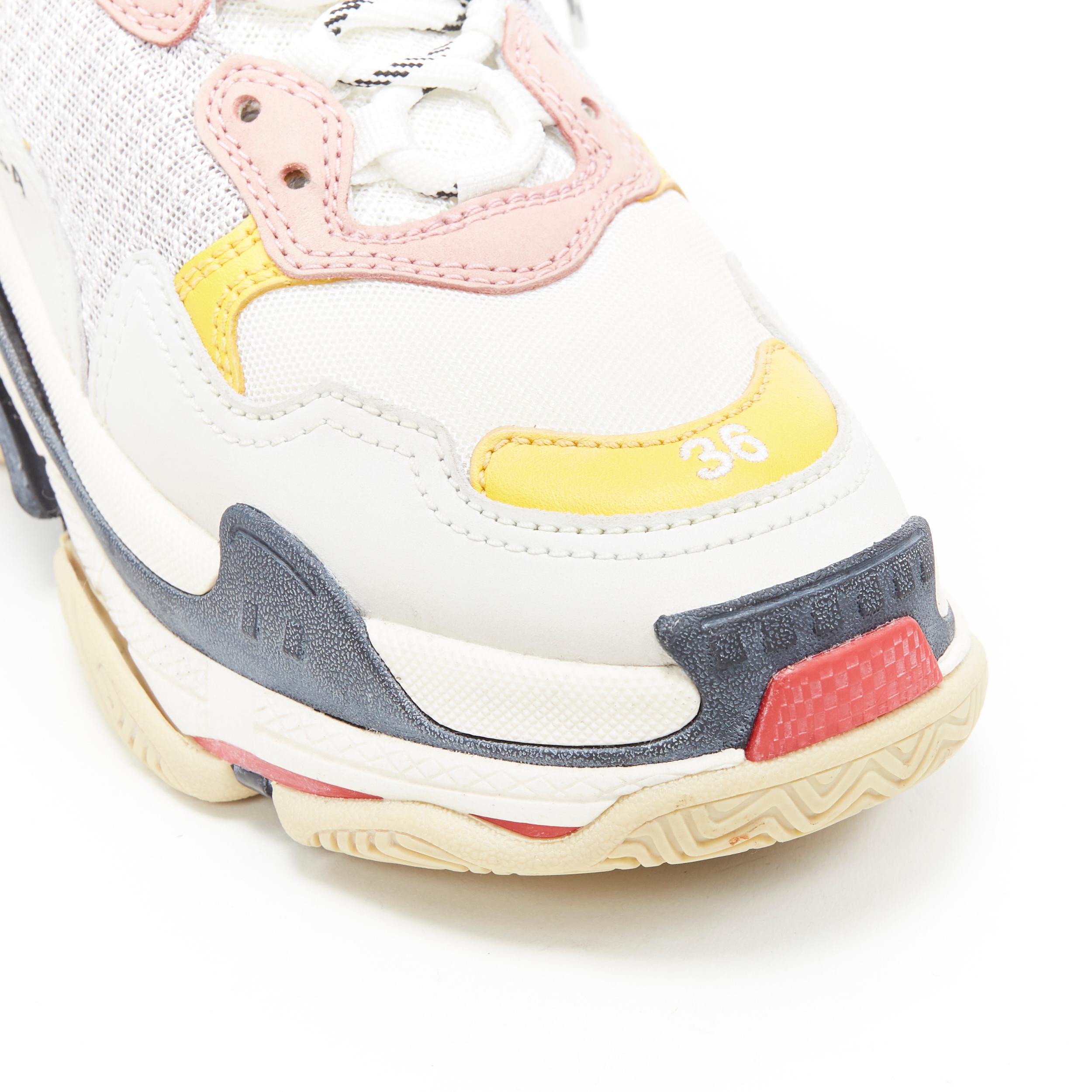 BALENCIAGA Triple S beige cream pink yellow accent chunky sole dad sneaker EU36
Brand: Balenciaga
Designer: Demna Gvasalia
Model Name / Style: Triple S
Material: Leather, beige knit
Color: Beige, pink and yellow detailing
Pattern: Other
Closure: