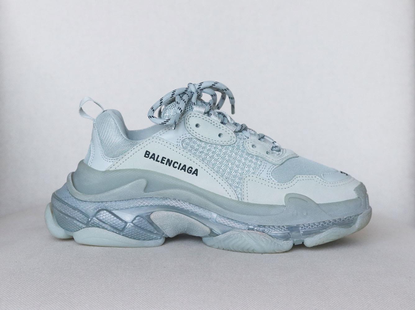 Balenciaga's coveted 'Triple S Clear Sole' design are the archetype of the season's 'dad sneaker' trend, so it's no surprise they're selling out so fast and this iteration is set on the signature triple-stacked sole and has panels of leather  for a