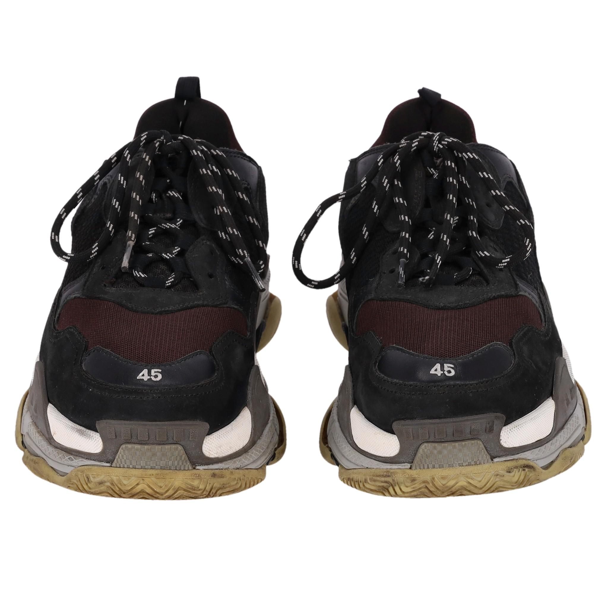 Balenciaga Triple S Leather, Nubuck & Mesh Sneakers

Black and burgundy sneakers crafted in mesh, nubuck and leather with hiking-style laces and dual pull tabs.

Detailed with white 'Balenciaga' lettering to the side, set on unique layered soles in