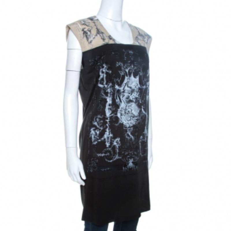 Este precioso top túnica procede de la casa Balenciaga. Confeccionado con tejidos de calidad, este top presenta tonos negros y beige. Tiene un estampado de Brasso barroco que le añade interés. Este top sin mangas tiene una silueta relajada y es