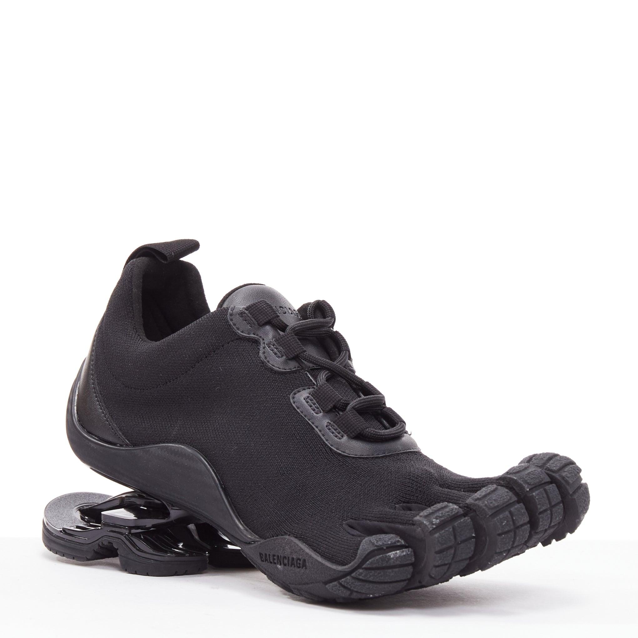 BALENCIAGA Vibram Toe black technical 5-toe suspension heel sneakers EU37
Reference: TGAS/E00022
Brand: Balenciaga
Designer: Demna
Model: 636893 Toe
Collection: Vibram
Material: Fabric, Rubber
Color: Black
Pattern: Solid
Closure: Lace Up
Lining: