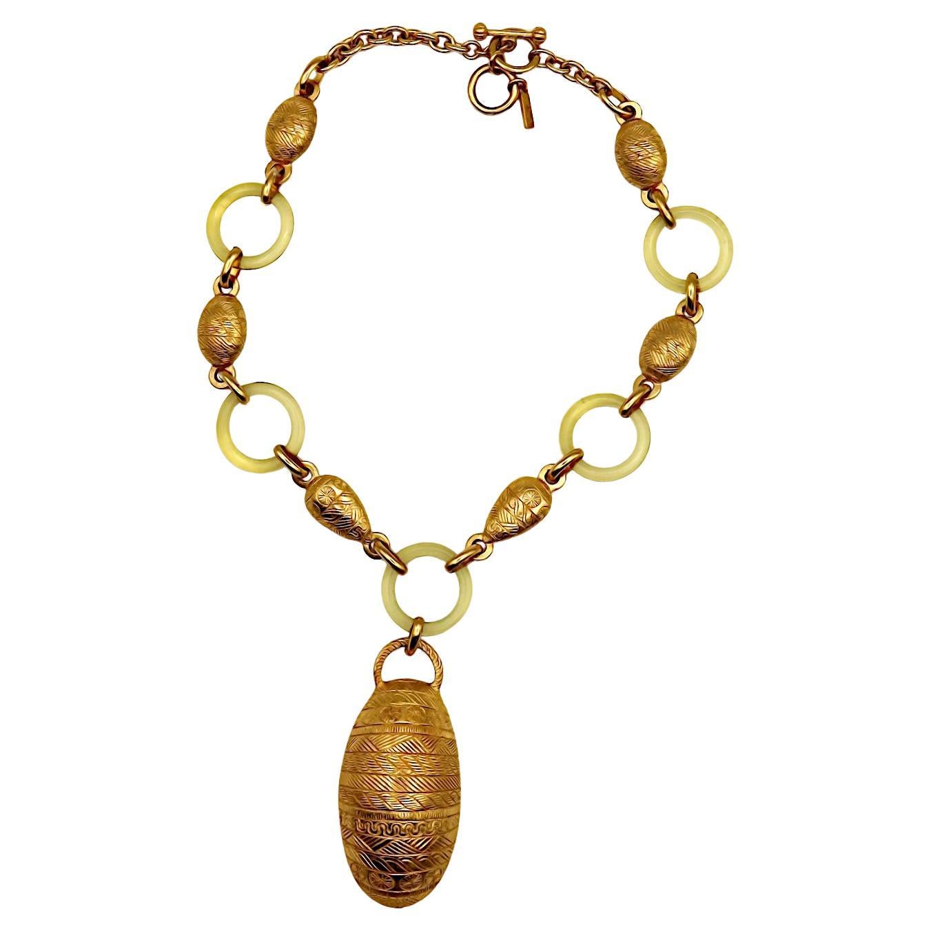 BALENCIAGA Vintage Gold Tone and Resin African Tribal Motif Pendant Necklace For Sale