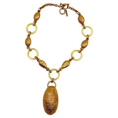 BALENCIAGA Vintage Gold Tone and Resin African Tribal Motif Pendant Necklace