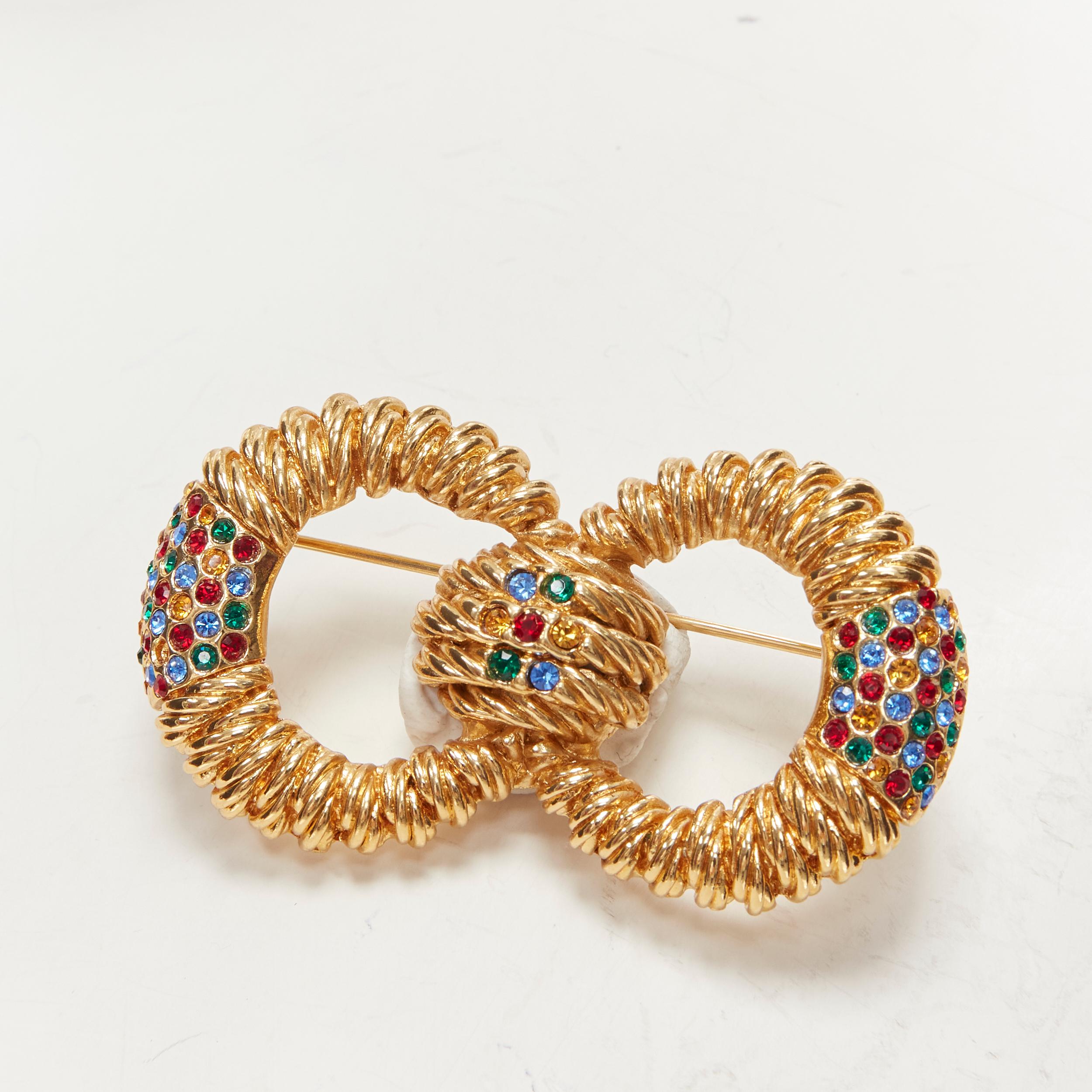 BALENCIAGA Vintage gold-tone crystal embellished interlinked pin brooch
Brand: Balenciaga
Material: Metal
Color: Gold
Pattern: Solid
Closure: Pin

CONDITION:
Condition: Excellent, this item was pre-owned and is in excellent condition.