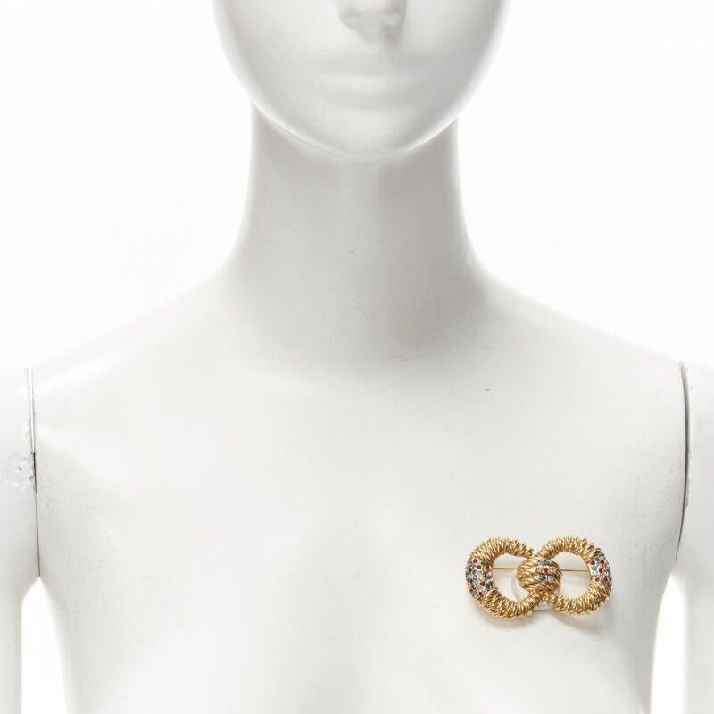 BALENCIAGA Vintage gold-tone crystal embellished interlinked pin brooch
Reference: JECW/A00006
Brand: Balenciaga
Material: Metal
Color: Gold
Pattern: Solid
Closure: Pin

CONDITION:
Condition: Excellent, this item was pre-owned and is in excellent