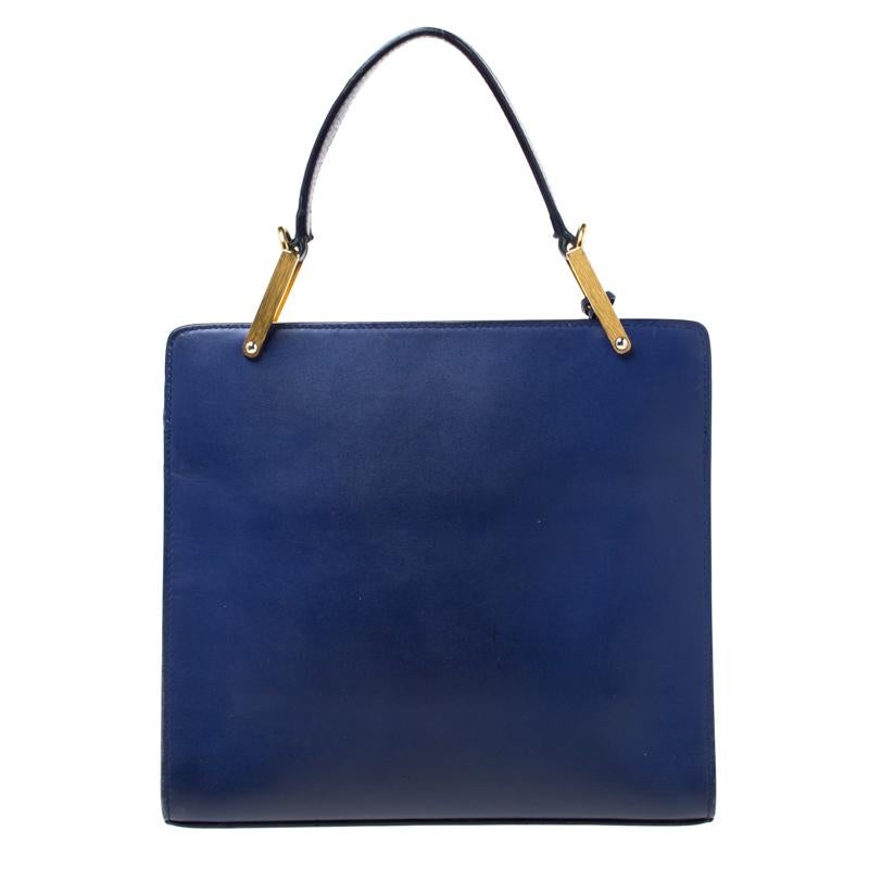 This Balenciaga design is overflowing with luxury and style! It comes crafted from leather and designed with a front flap and a top handle. The violet shade is classy and the spacious interior that is lined with leather will help carry your