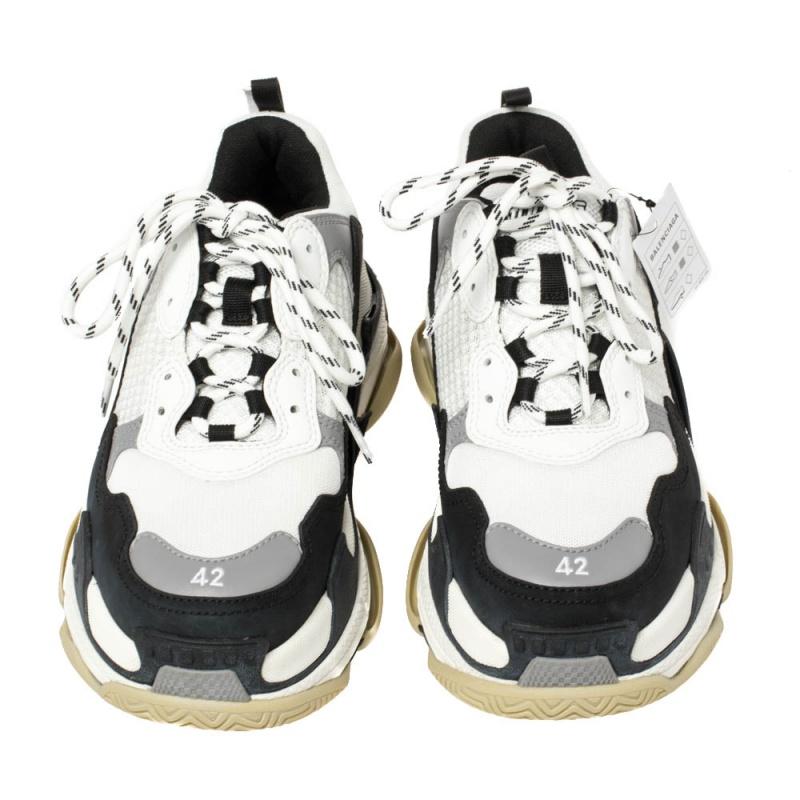 One of Balenciaga's many hit designs, the Triple S is a shoe that strays away from minimal forms and simple silhouettes. These are crafted from leather and mesh into a chunky size, achieved by the high complex soles. They feature the shoe size on