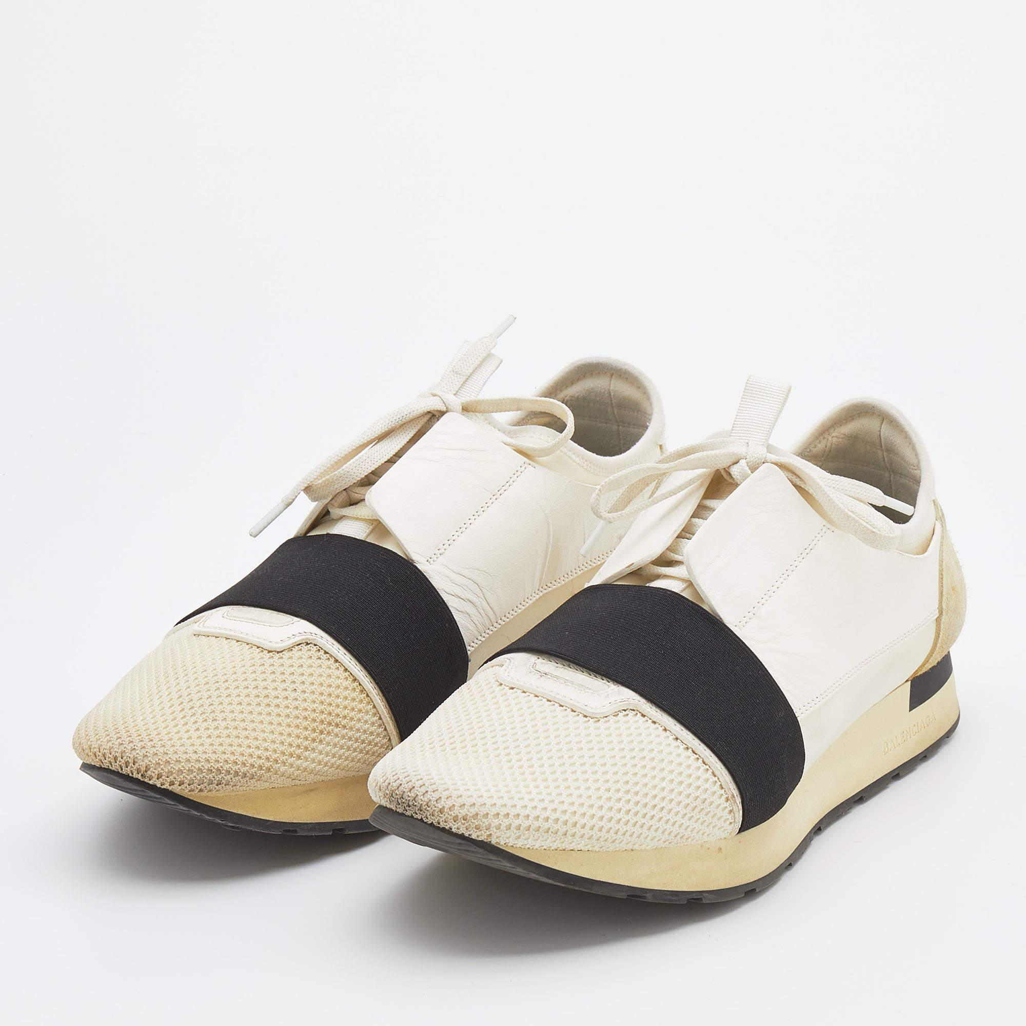The Balenciaga Race Runner sneakers have been crafted from quality materials and feature a chic silhouette. They flaunt covered toes, strap detailing on the vamps, and tie-up fastenings. They are complete with a leather-lined insole and a tough base