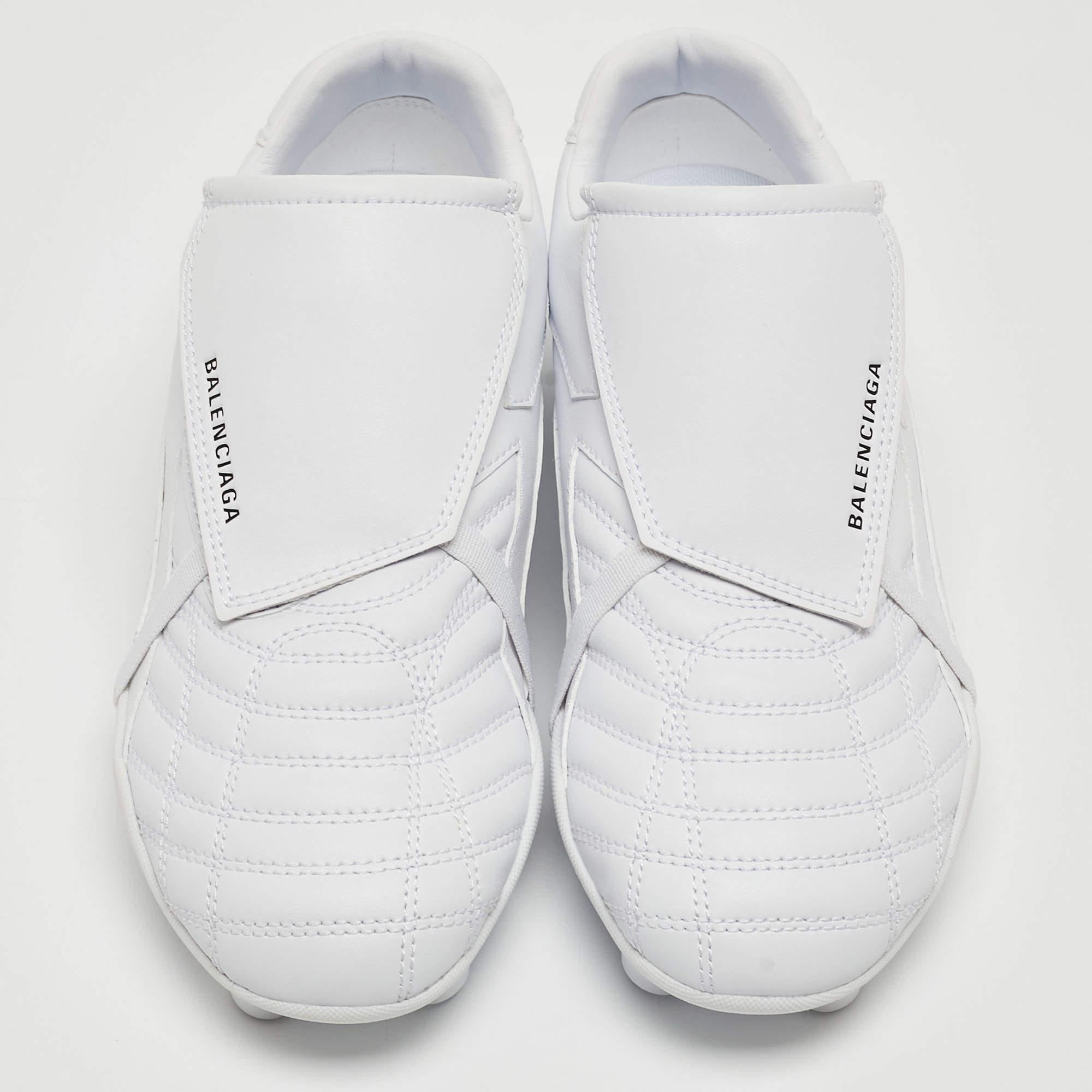 Elevate your casual attire with Balenciaga's sneakers. Crafted with precision from high-quality faux leather, these sneakers exude contemporary charm. The clean white hue adds versatility, while the soccer-inspired design offers a sporty edge.
