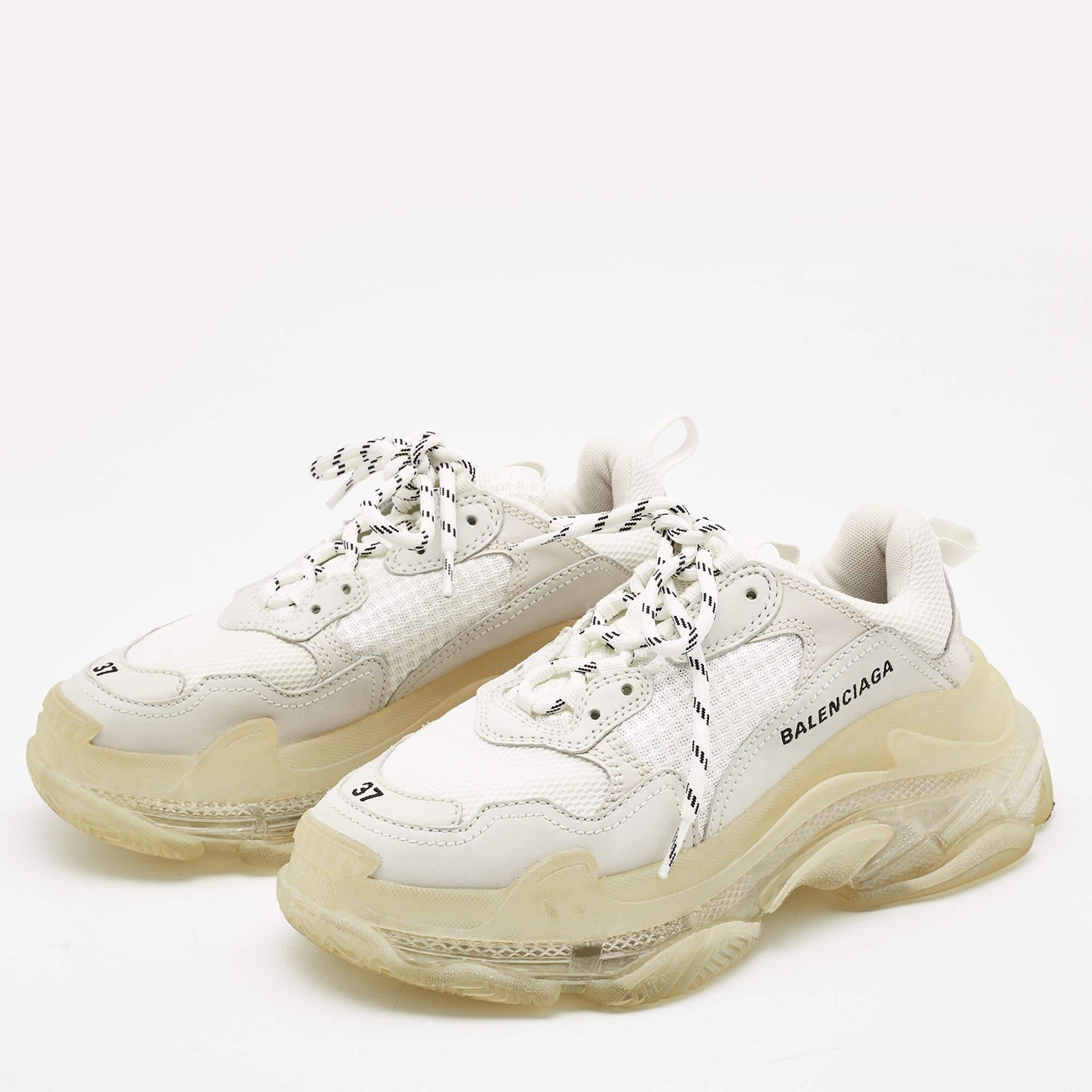 One of Balenciaga's many hit designs, the Triple S is a shoe that strays away from minimal forms and simple silhouettes. These are crafted from a mix of materials into a chunky size, achieved by the high complex soles. They feature the shoe size on