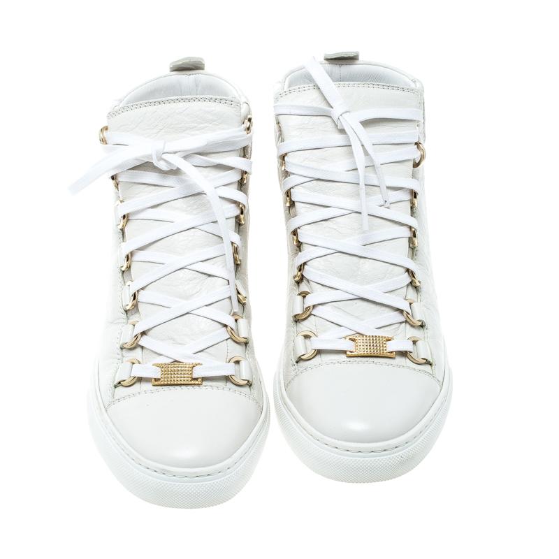 The clean-cut look in these Arena sneakers from Balenciaga is created with the white leather exterior, finished off with lace up front and complementing platform soles. These are a perfect pair to dress up or down for your off-duty
