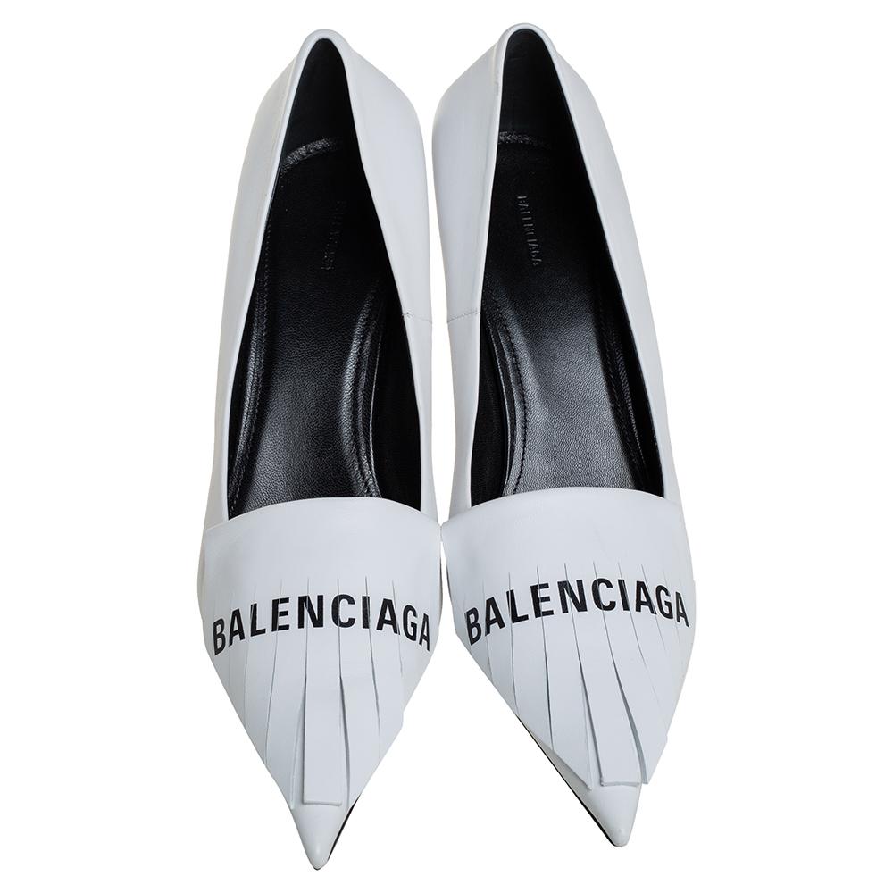 If you are an admirer of the latest fashion trends, this pair of Balenciaga pumps will add just the right vibe to your closet. The pointed-toe leather pumps are covered in white and come detailed with the label name on the fringed vamps and elevated