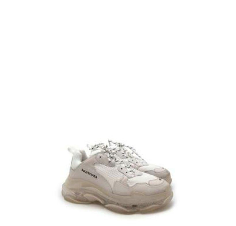 Balenciaga White Leather & Mesh Triple S Clear Sole Trainers
 
 - Iconic, sports-inspired Triple S shape with chunky sole 
 - White tone-on-tone upper, with clear sole 
 
 Materials 
 Leather 
 Rubber
 Textile
 
 Made in China 
 
 9.5/10 Excellent