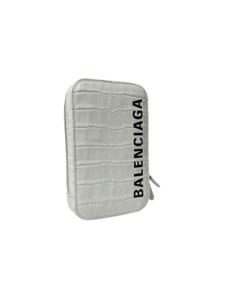 Mini shoulder bag by Balenciaga, made of white crocodile patterned leather with black print and silver hardware. Zip closure, equipped with internal and external compartments. Equipped with adjustable and removable shoulder strap. The bag is in