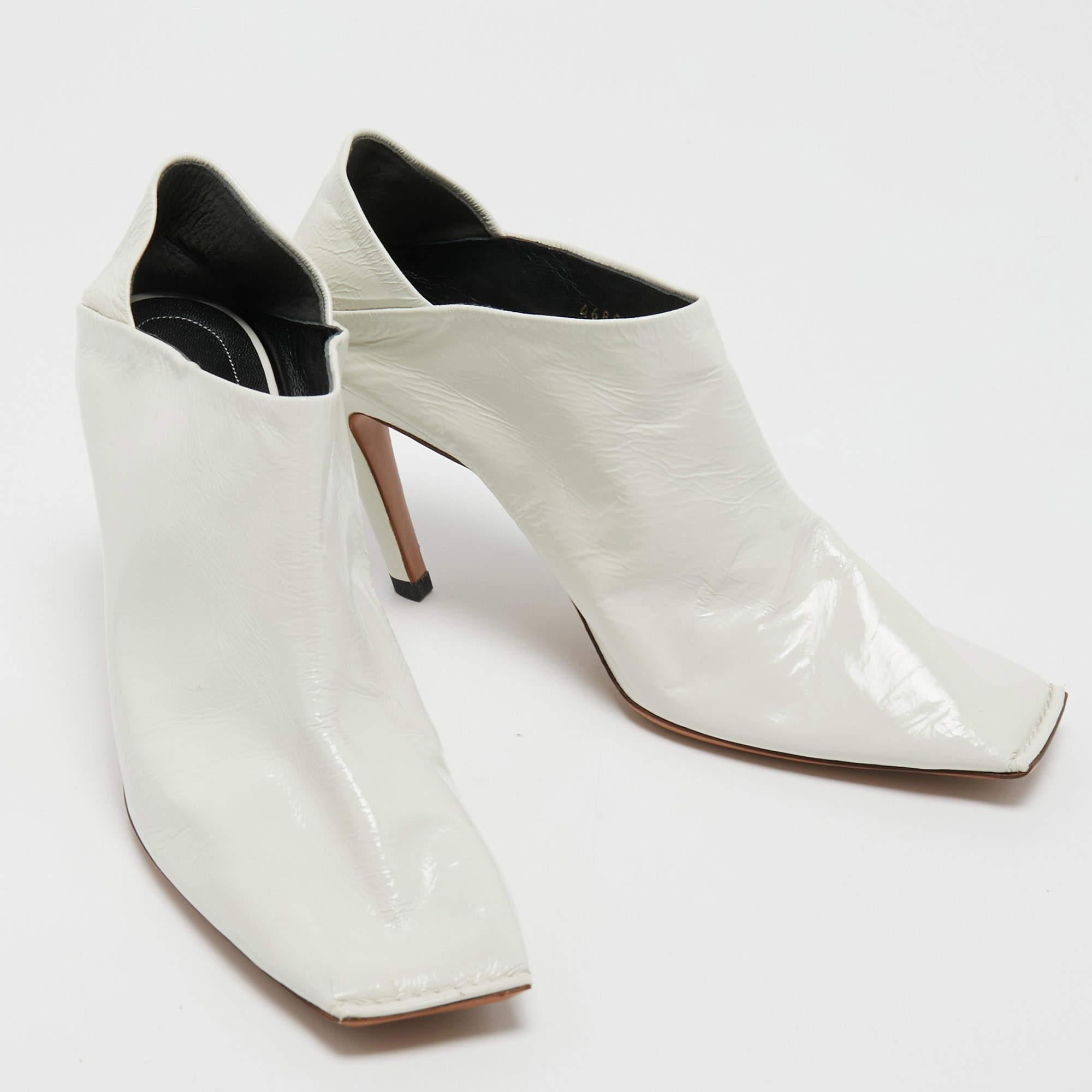Let your latest shoe addition be this fabulous pair of booties from Balenciaga. The white booties are crafted from leather and feature square toes and 9 cm heels.

